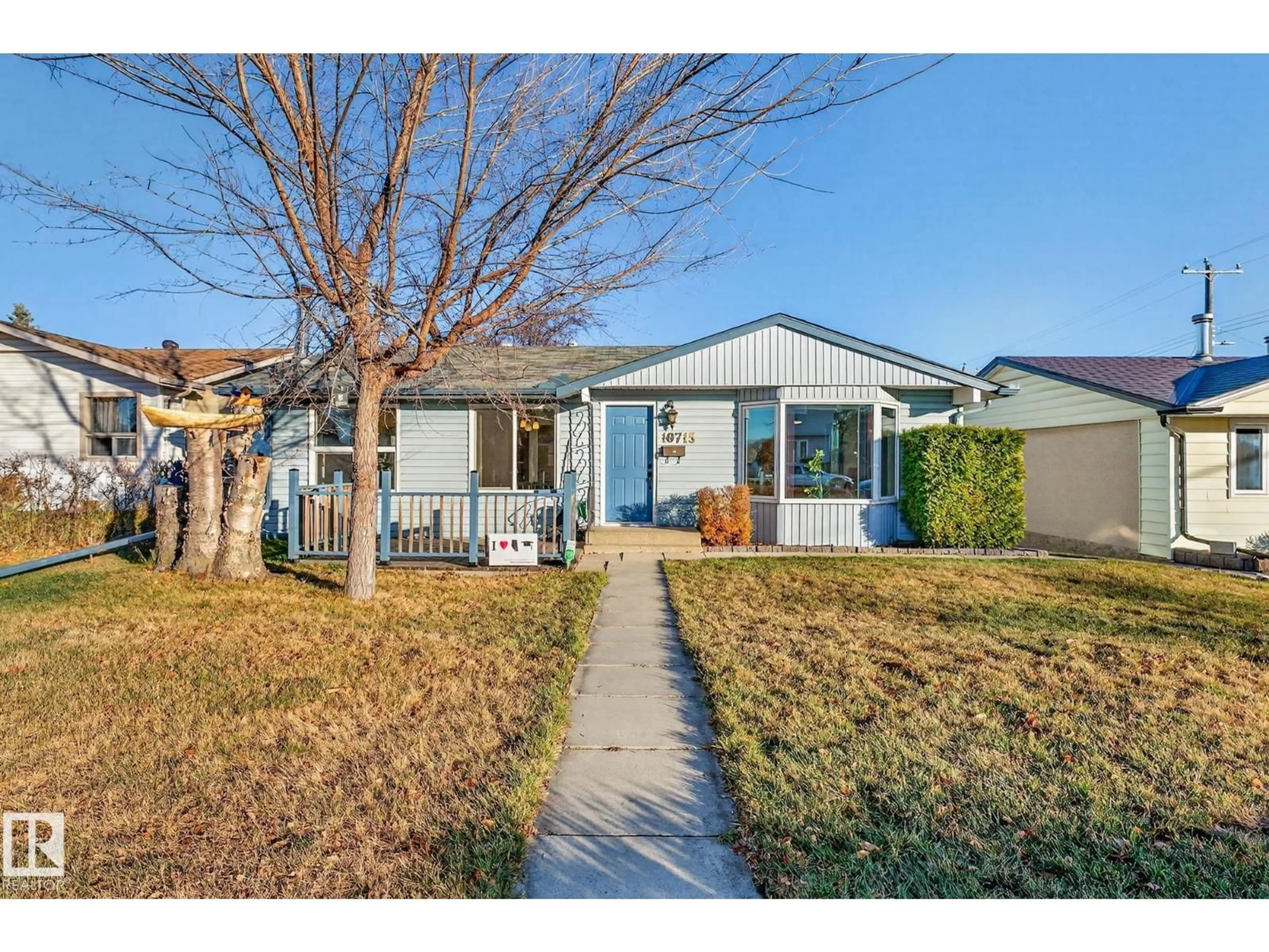 Home with vinyl exterior material, street for NW - 10715 36 ST, Edmonton Alberta T5W2A5