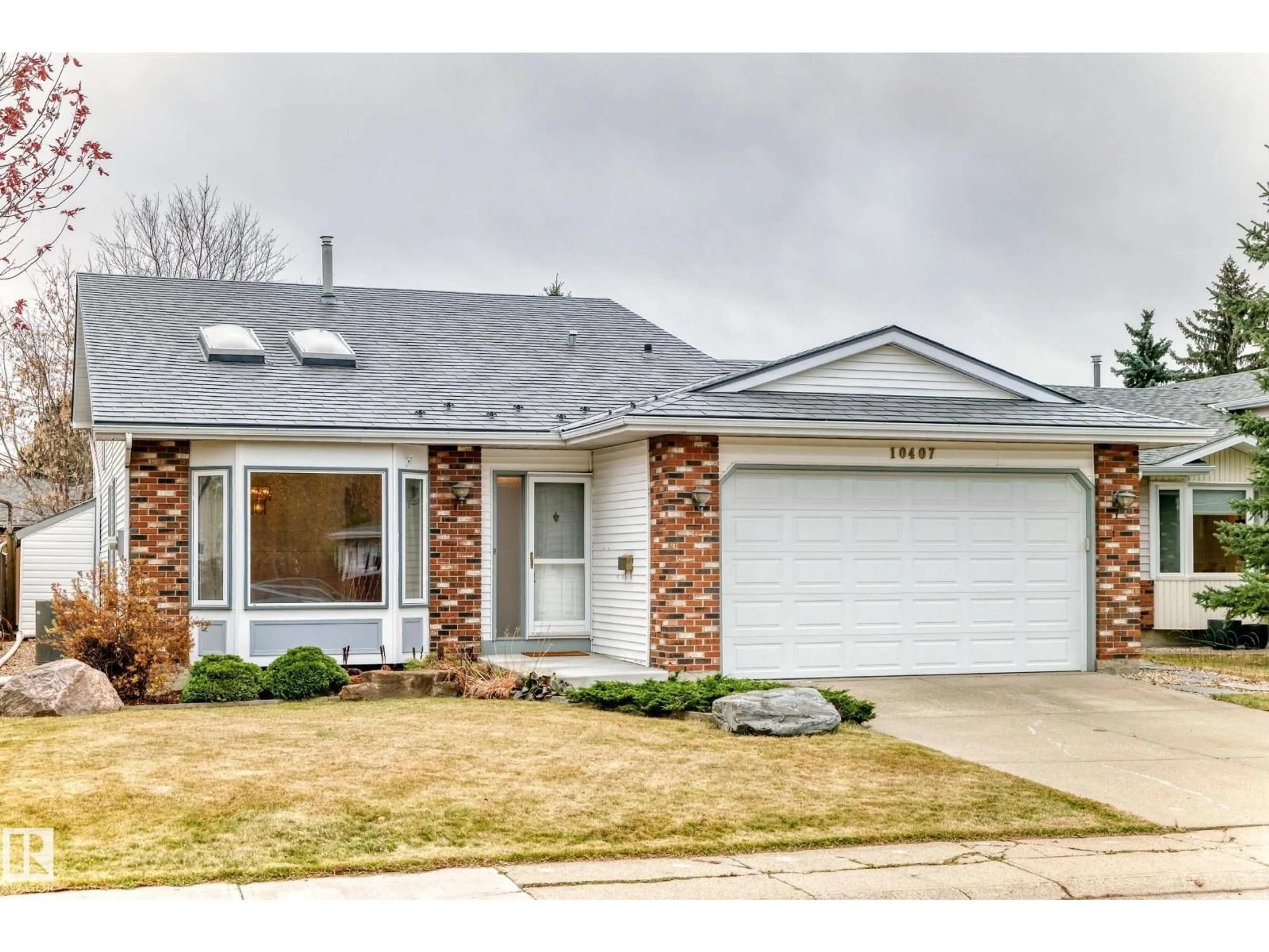 Home with brick exterior material, street for 10407 40 AV, Edmonton Alberta T6J6L1