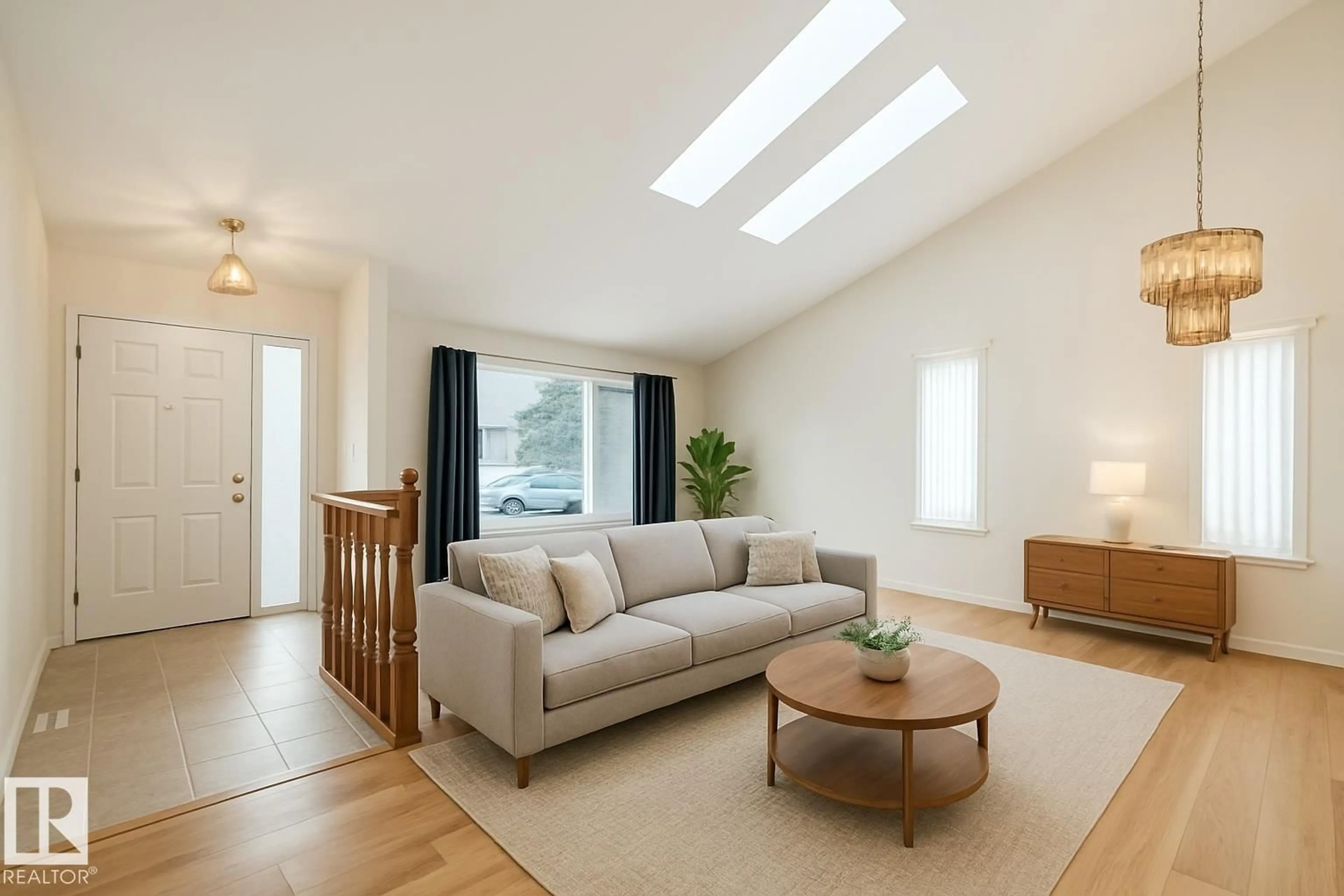 Living room with furniture, wood/laminate floor for 10407 40 AV, Edmonton Alberta T6J6L1