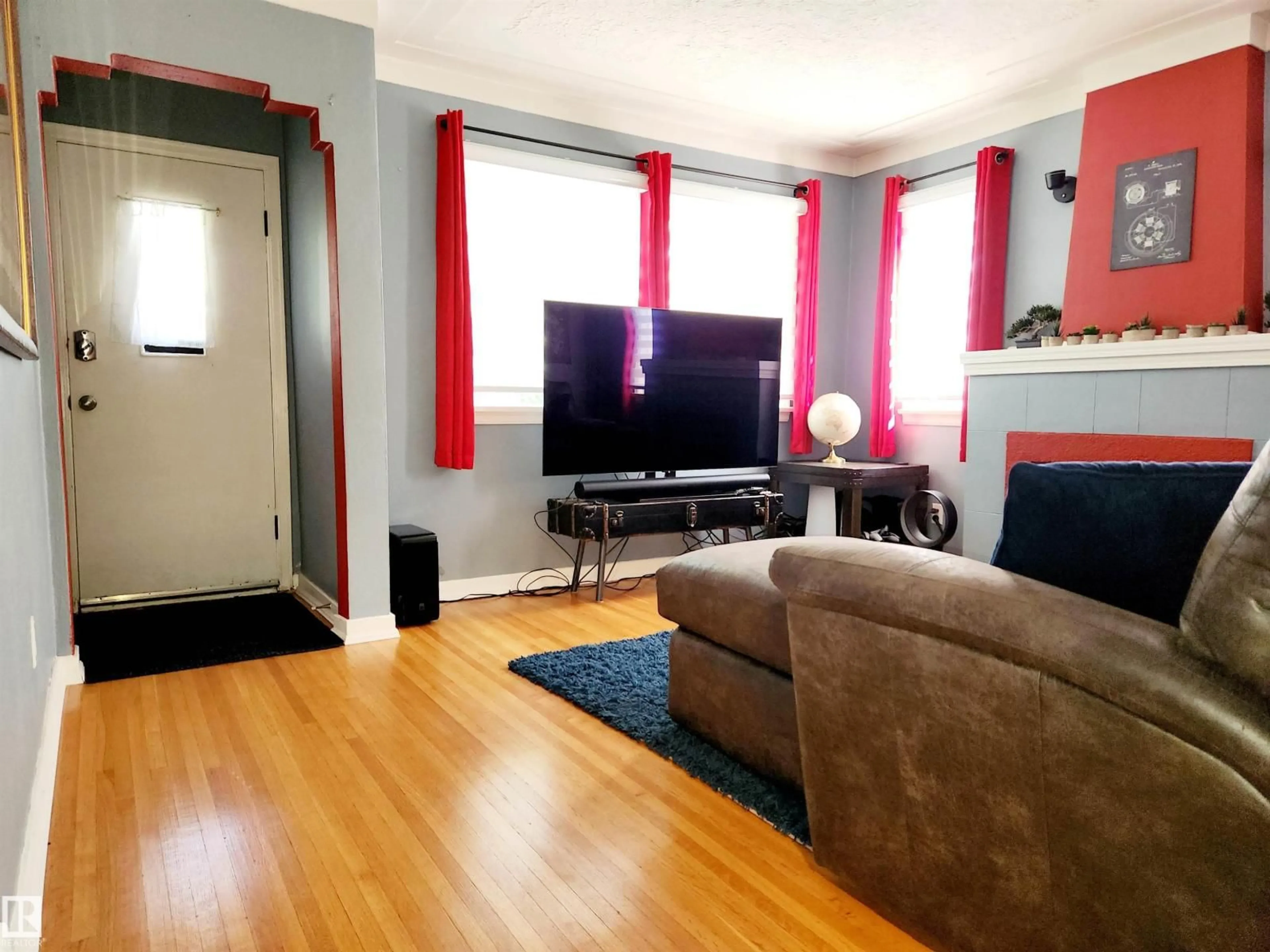 Living room with furniture, unknown for 10619 72 AV, Edmonton Alberta T6E0Z8