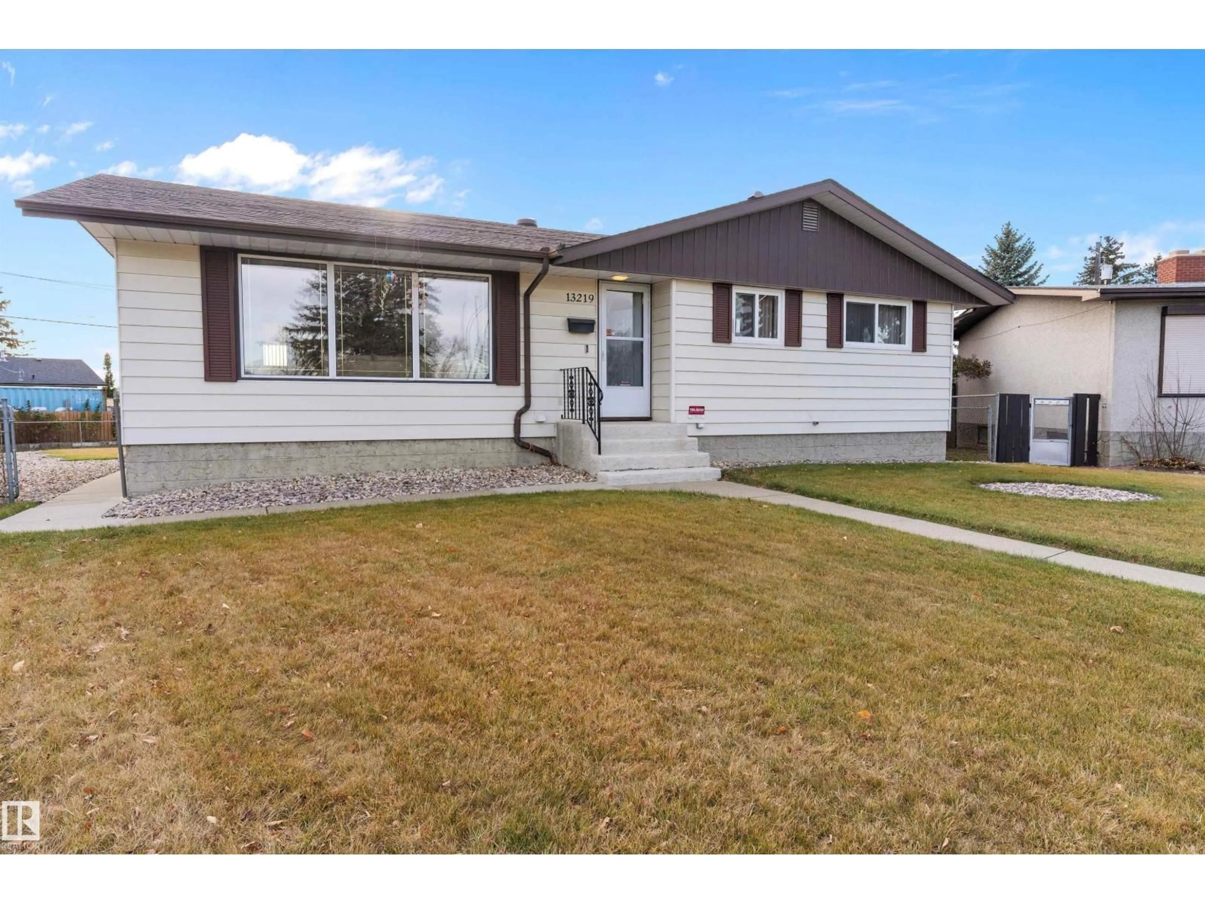 Home with vinyl exterior material, street for 13219 136A AV NW, Edmonton Alberta T5L4B7