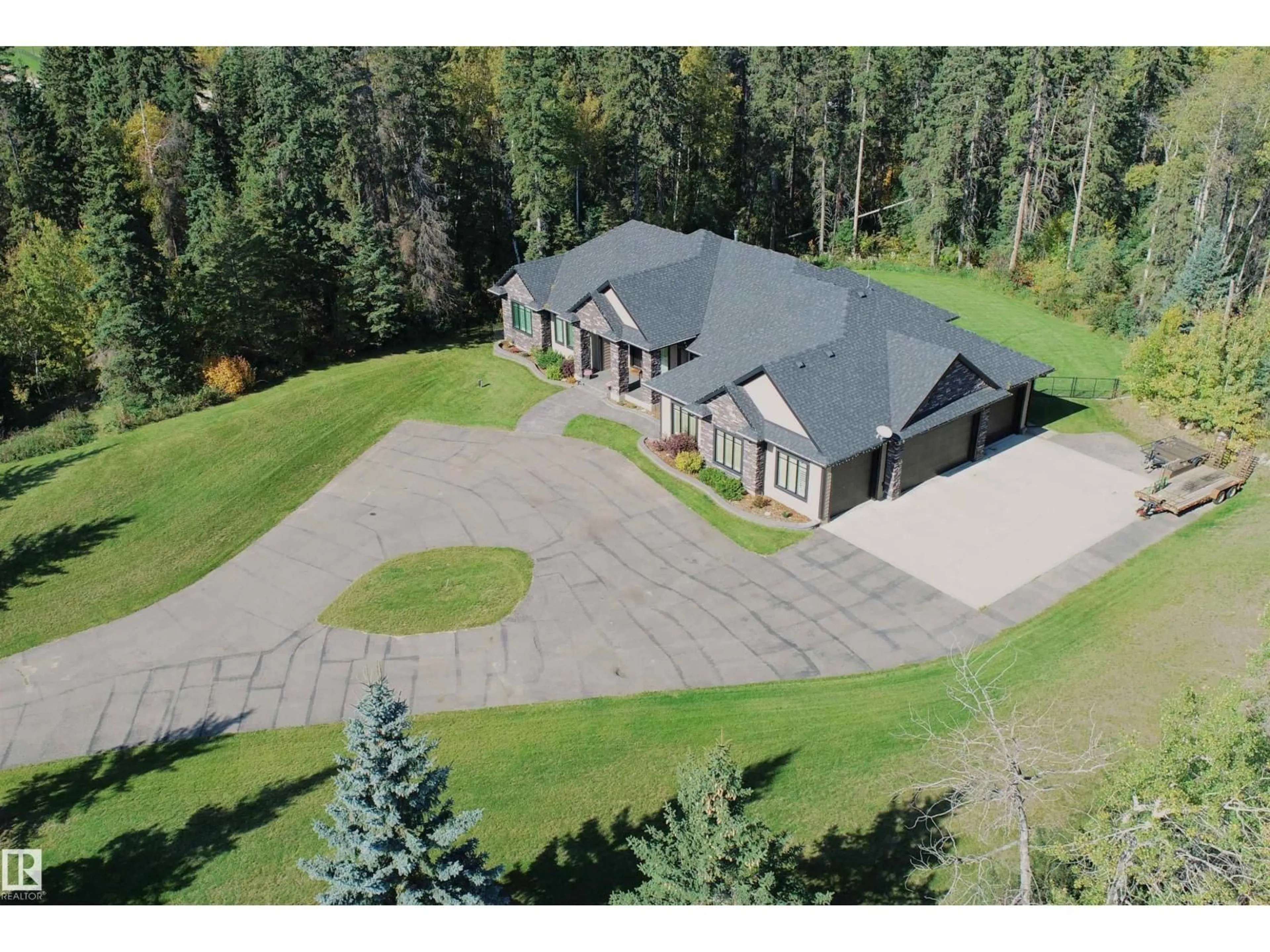 A pic from outside/outdoor area/front of a property/back of a property/a pic from drone, mountain view for 53120 - 2 RGE ROAD 15, Rural Parkland County Alberta T7Y2E4