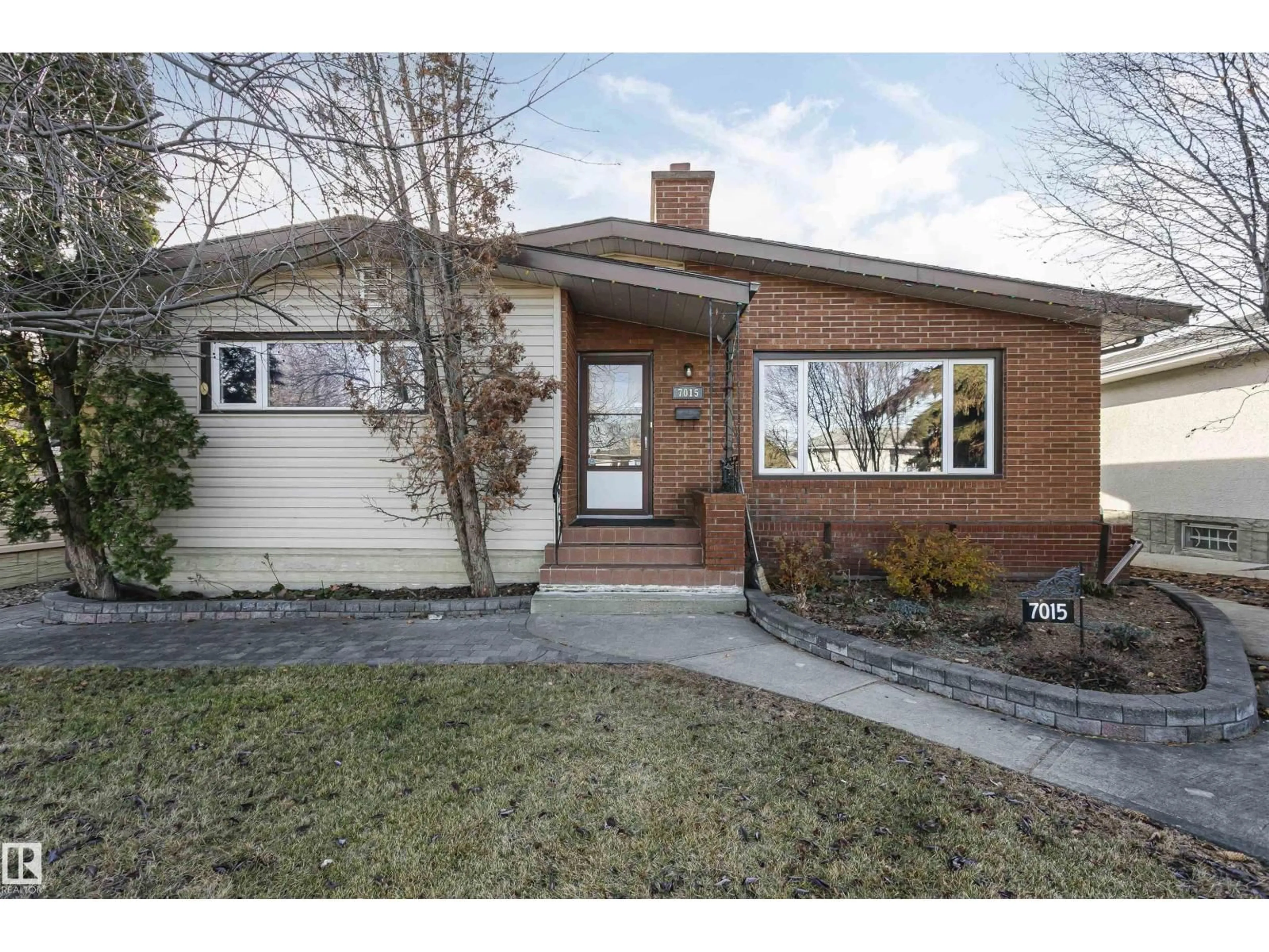 Home with brick exterior material, street for 7015 139 AV, Edmonton Alberta T5C2M3