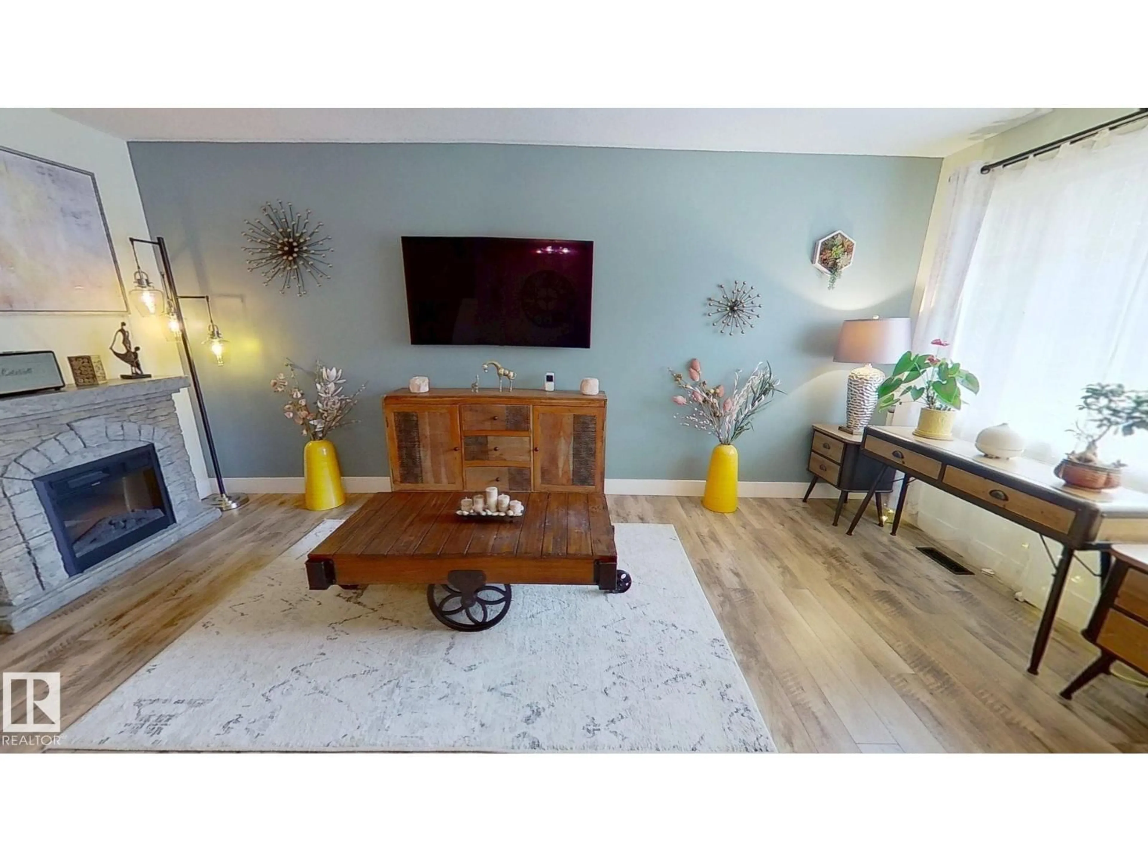 Living room with furniture, wood/laminate floor for NW - 7923 178 ST, Edmonton Alberta T5T1L3