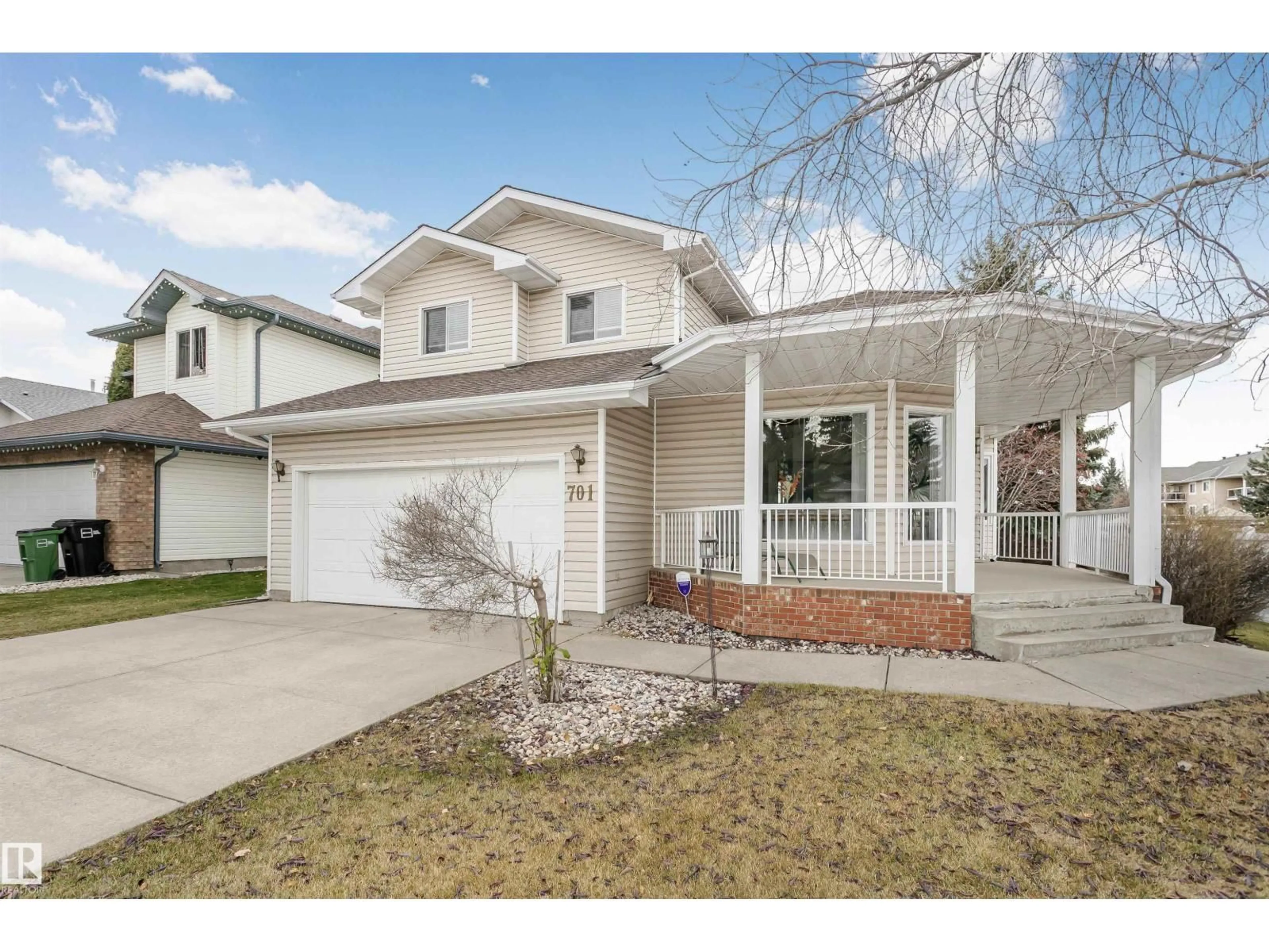 Home with vinyl exterior material, street for 701 REVELL CR, Edmonton Alberta T6R2G1