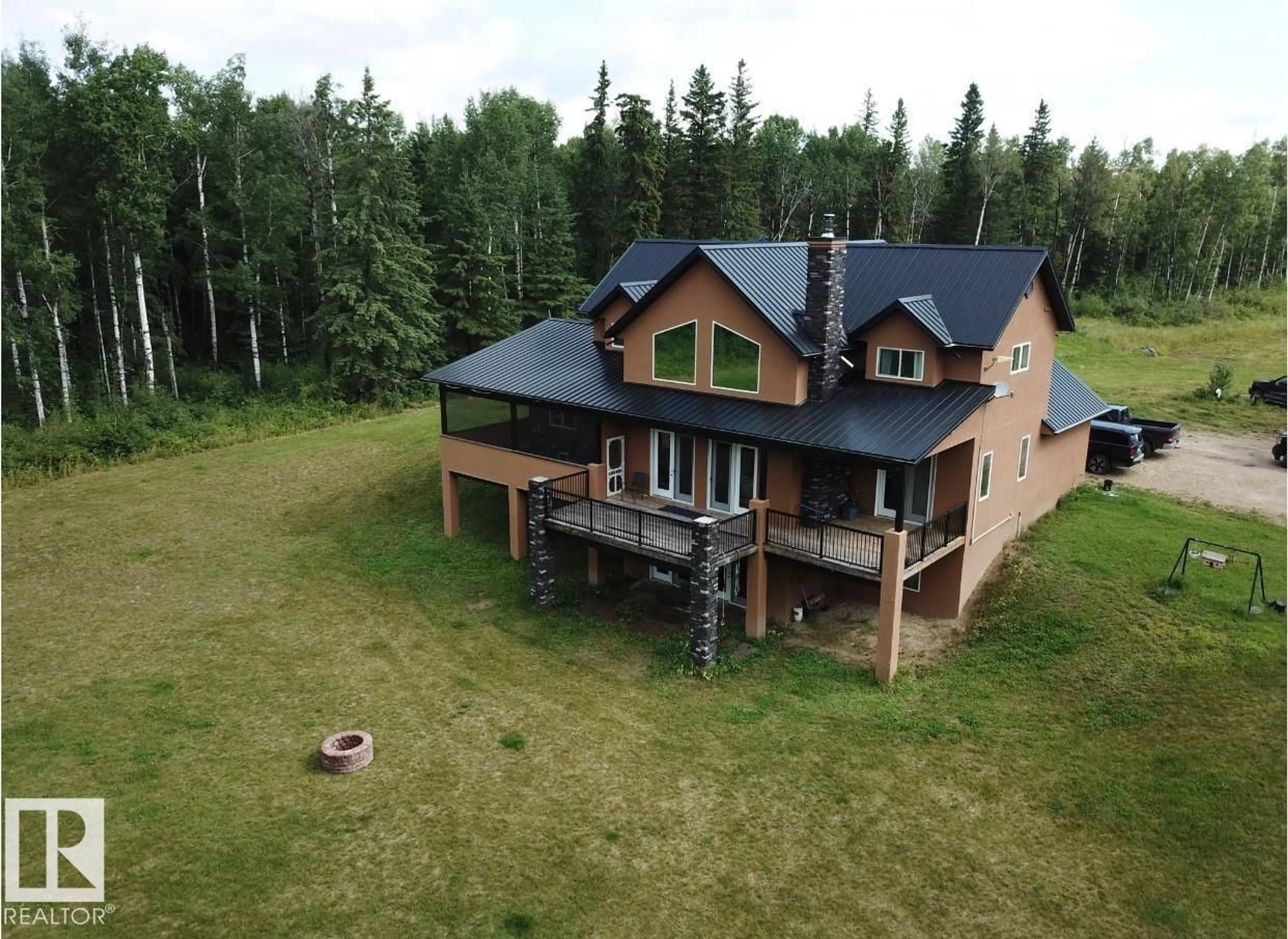 A pic from outside/outdoor area/front of a property/back of a property/a pic from drone, building for 620081 RGE RD 62, Rural Woodlands County Alberta T0G1A0
