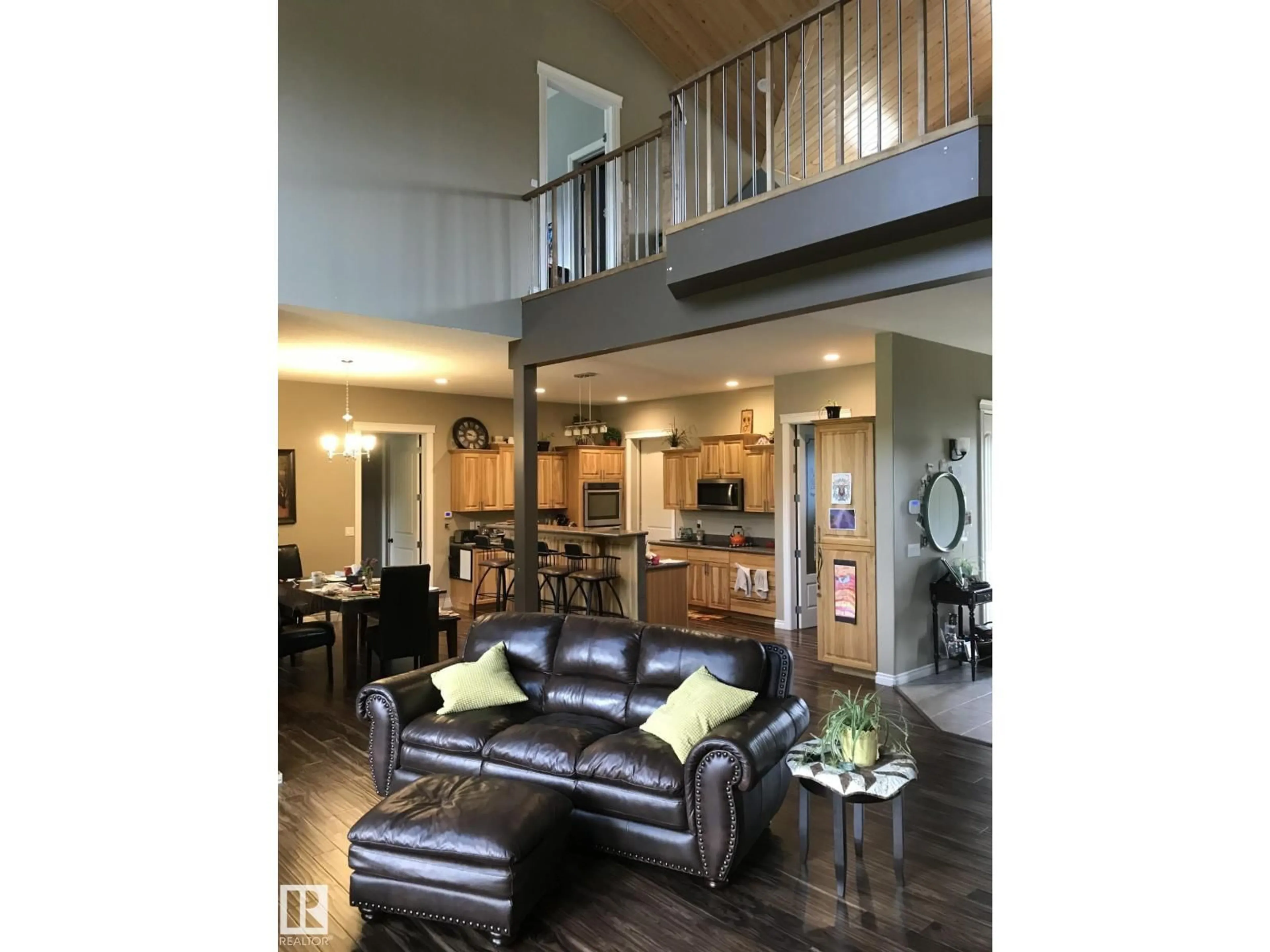 Living room with furniture, wood/laminate floor for 620081 RGE RD 62, Rural Woodlands County Alberta T0G1A0