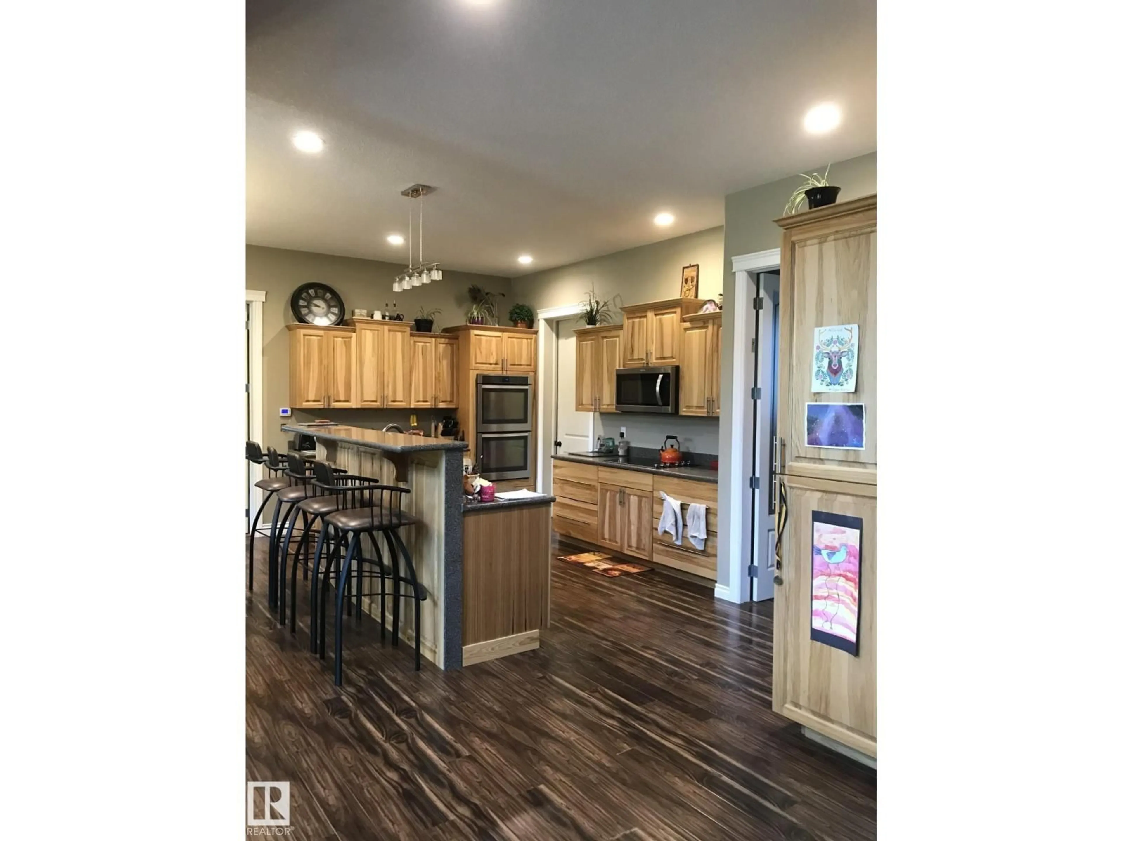 Open concept kitchen, wood/laminate floor for 620081 RGE RD 62, Rural Woodlands County Alberta T0G1A0