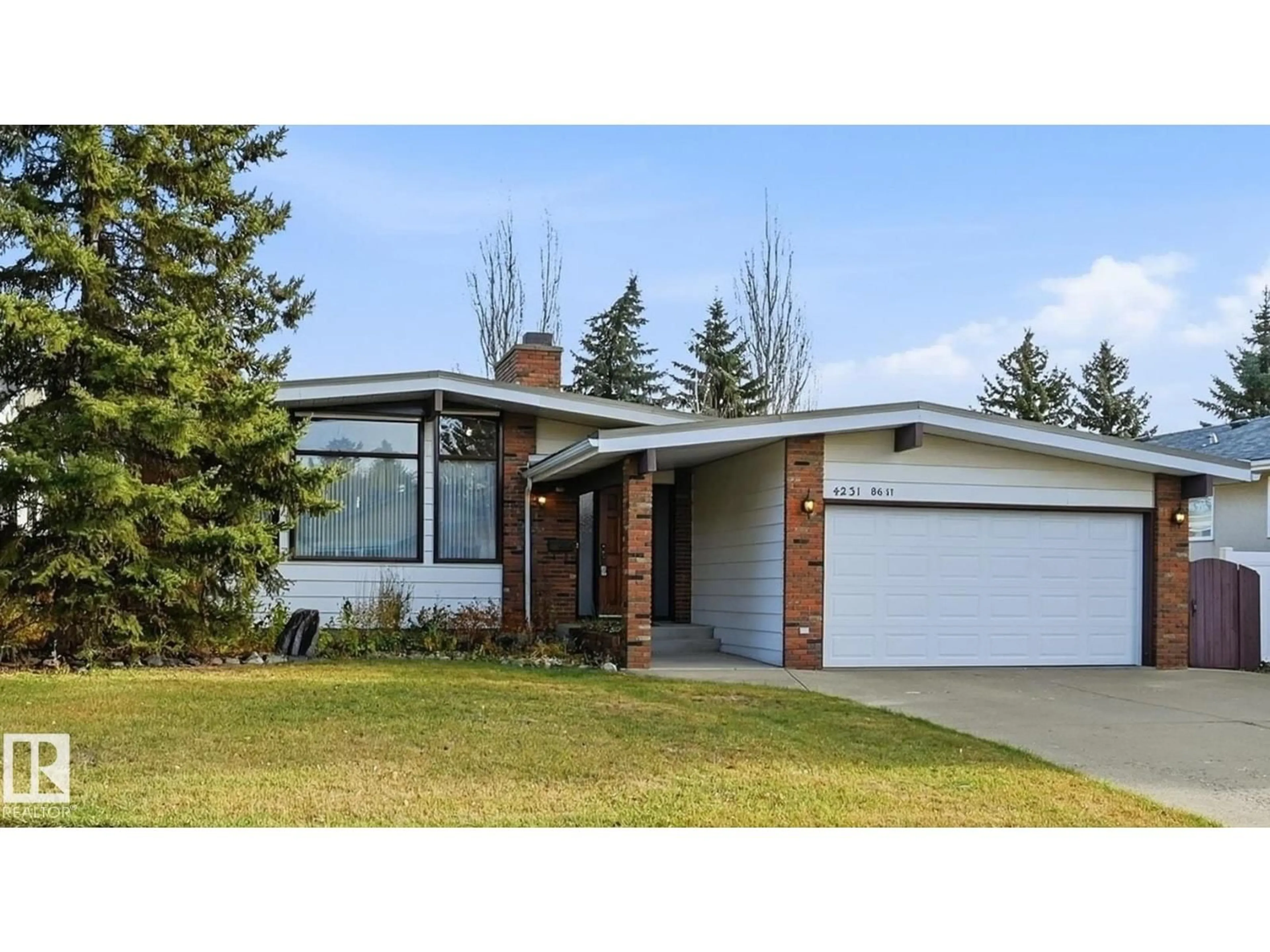 Home with vinyl exterior material, street for NW - 4231 86 ST, Edmonton Alberta T6K1C5