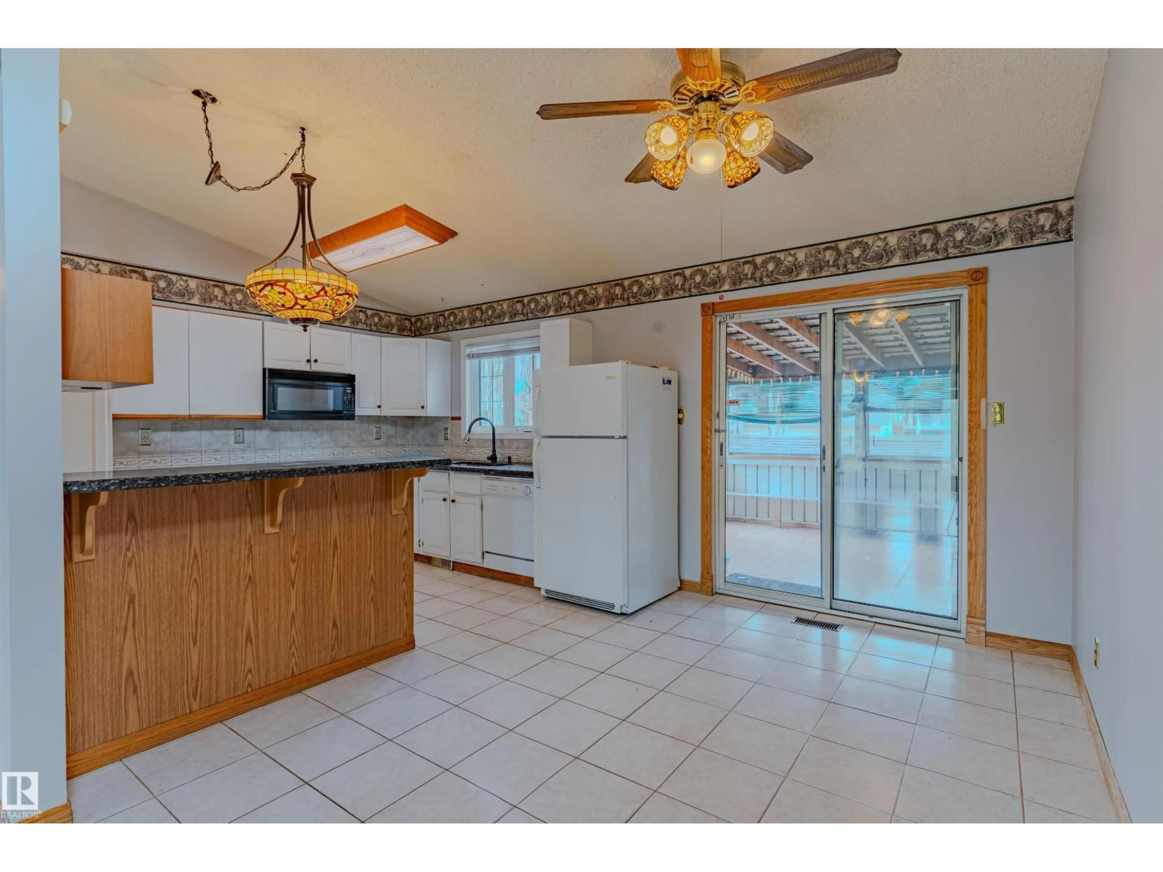 Open concept kitchen, ceramic/tile floor for 1353 39 ST, Edmonton Alberta T6L2M6