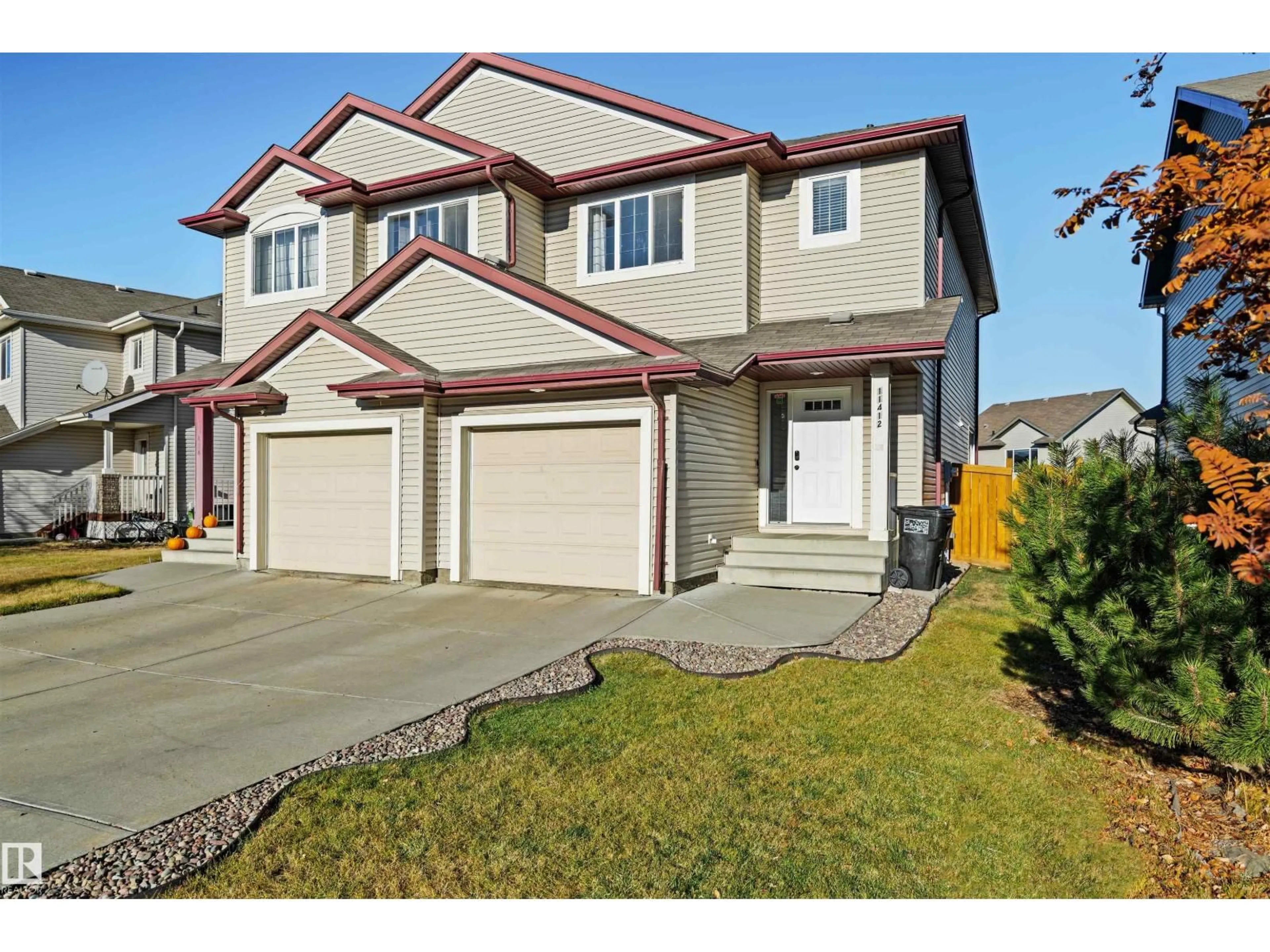 Home with vinyl exterior material, street for 11412 14 AV, Edmonton Alberta T6W0J6