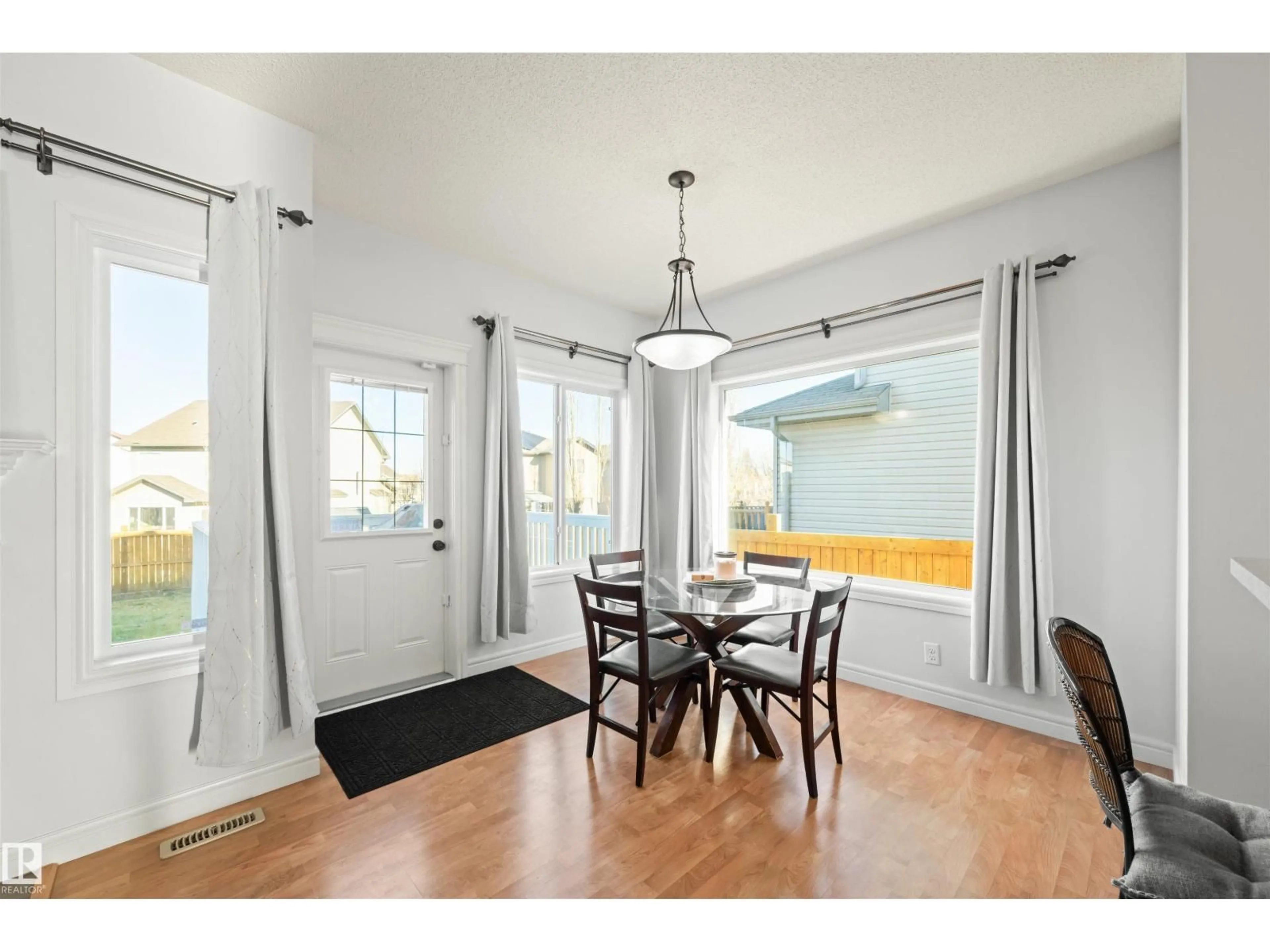 Dining room, wood/laminate floor for 11412 14 AV, Edmonton Alberta T6W0J6