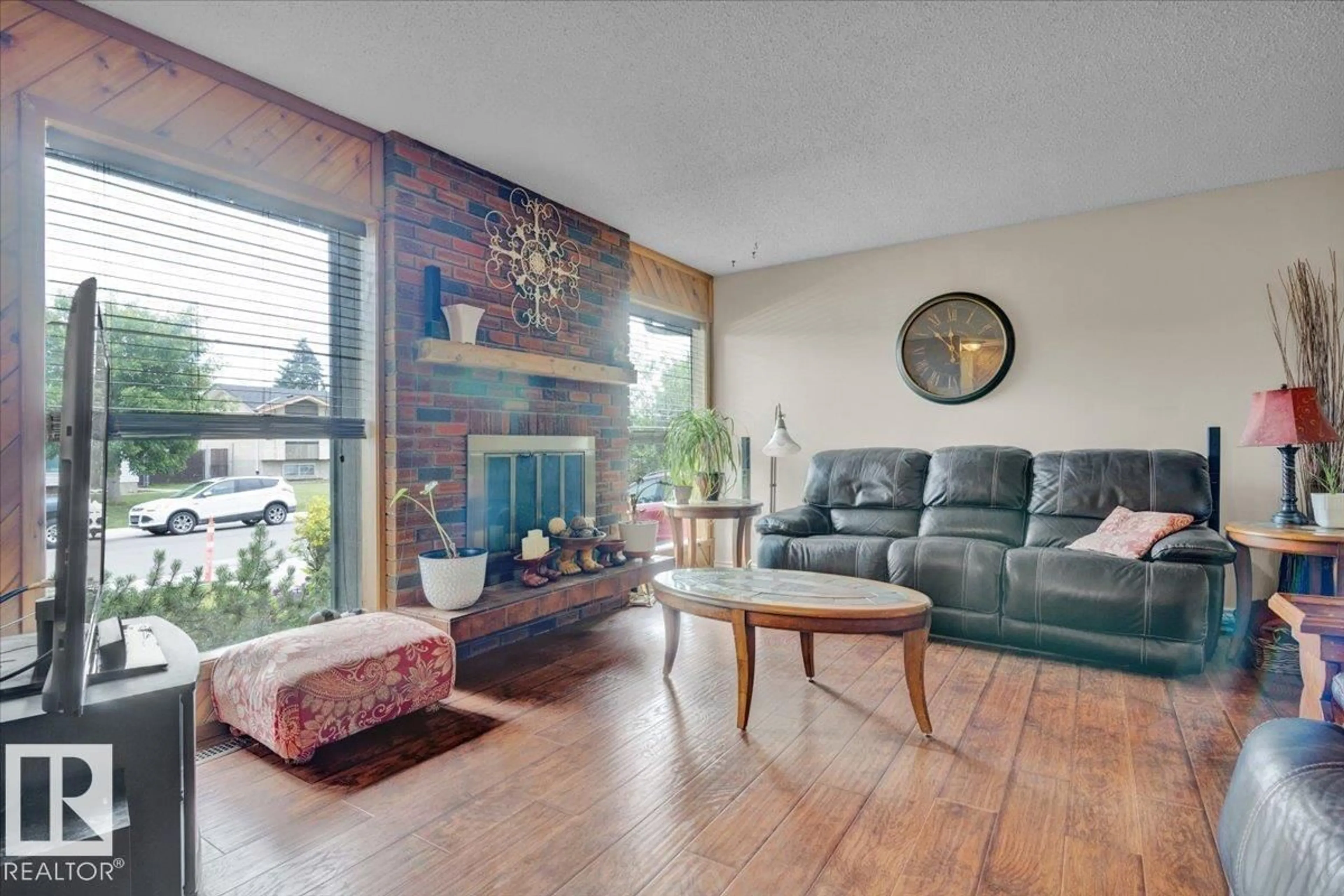 Living room with furniture, wood/laminate floor for 10217 167A AV, Edmonton Alberta T5X2Y8