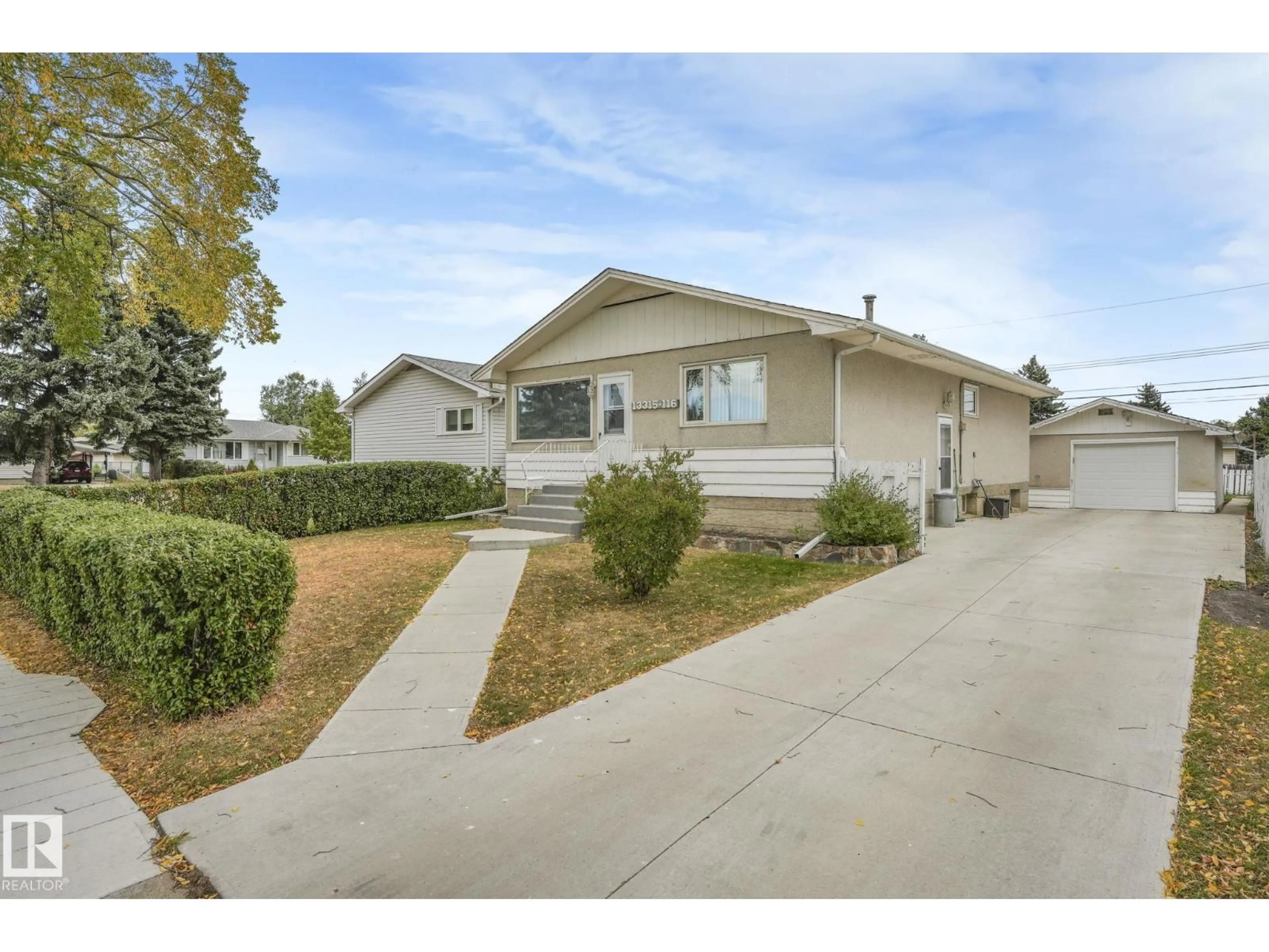 Home with vinyl exterior material, street for 13315 116 ST, Edmonton Alberta T5E5H8