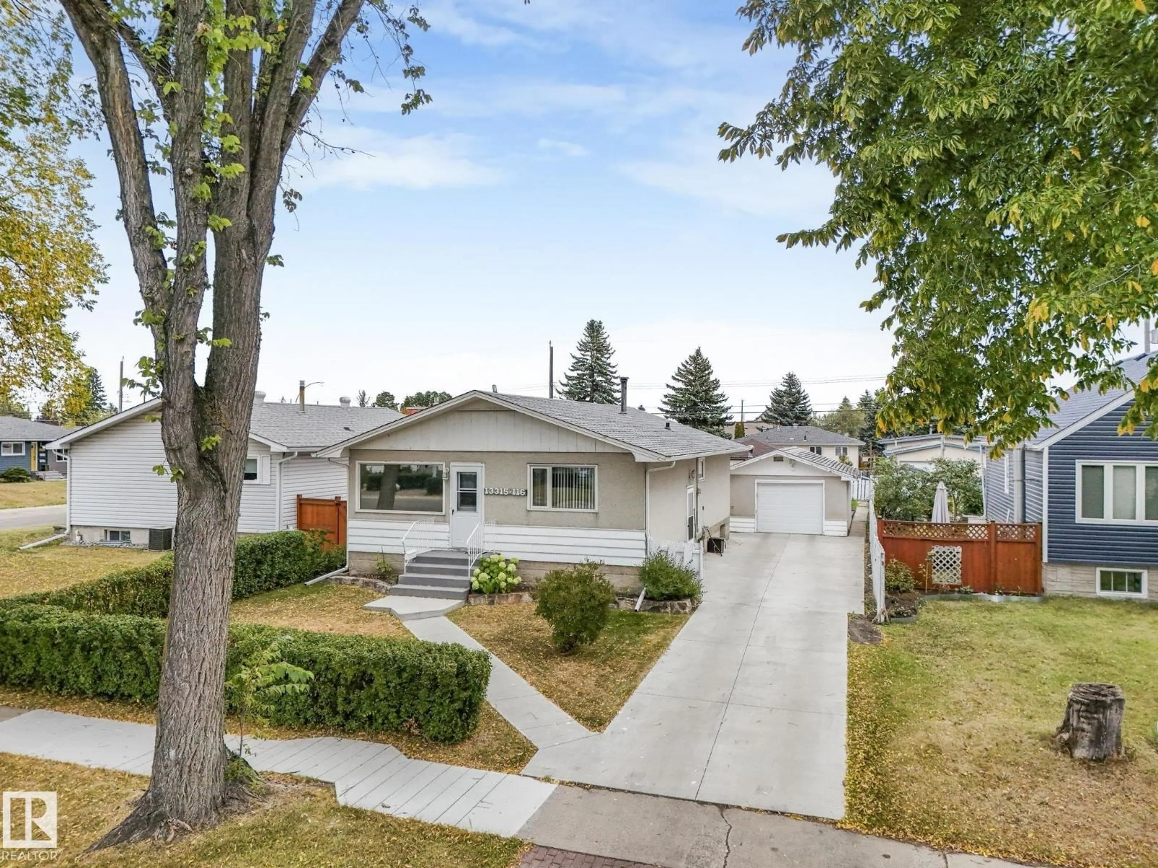 Home with vinyl exterior material, street for 13315 116 ST, Edmonton Alberta T5E5H8