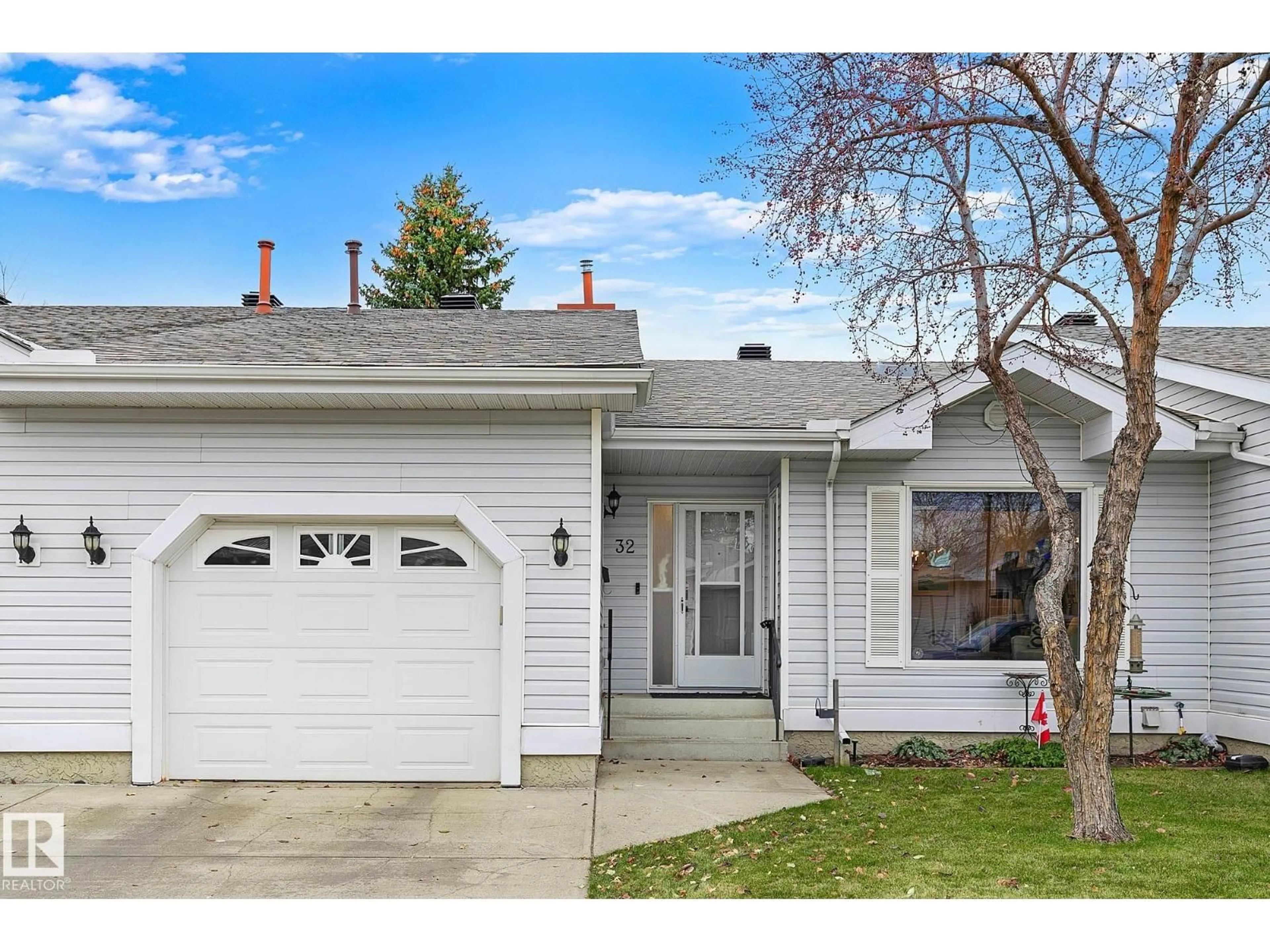 Home with vinyl exterior material, street for #32 - 9704 165 ST NW, Edmonton Alberta T5P4W4