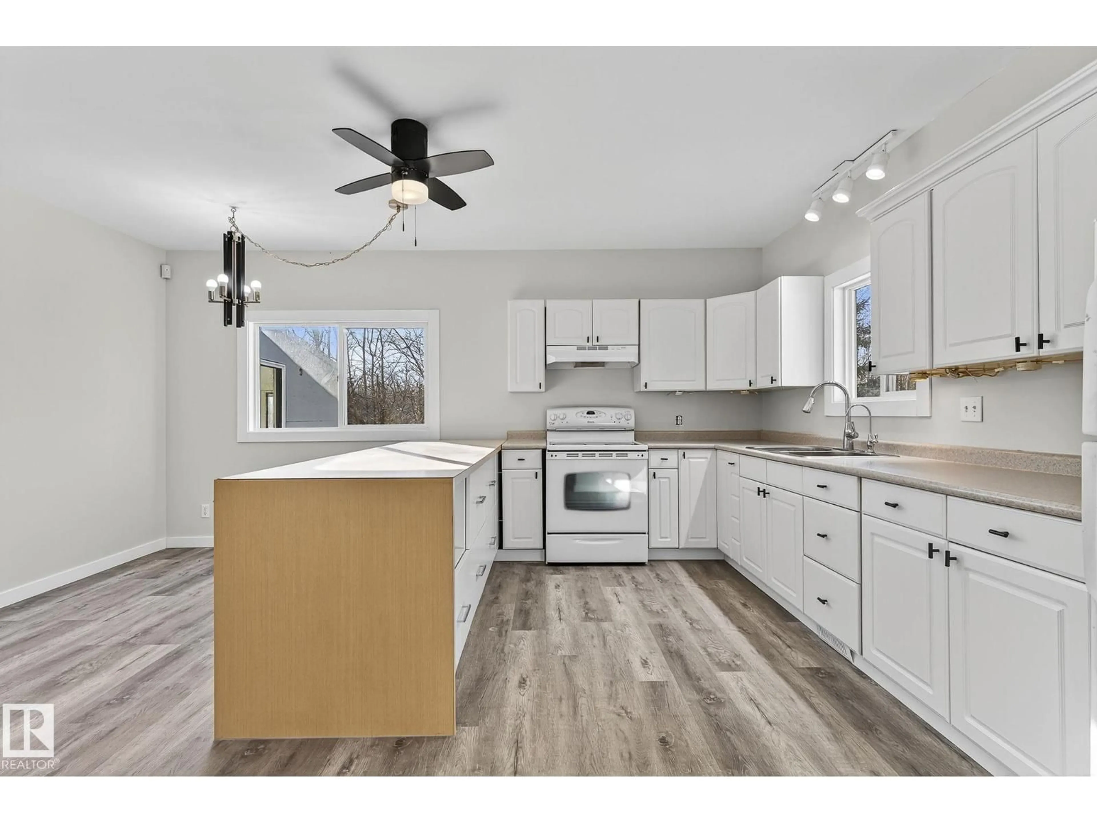 Open concept kitchen, wood/laminate floor for 49551 RANGE ROAD 202, Rural Camrose County Alberta T0B0C0