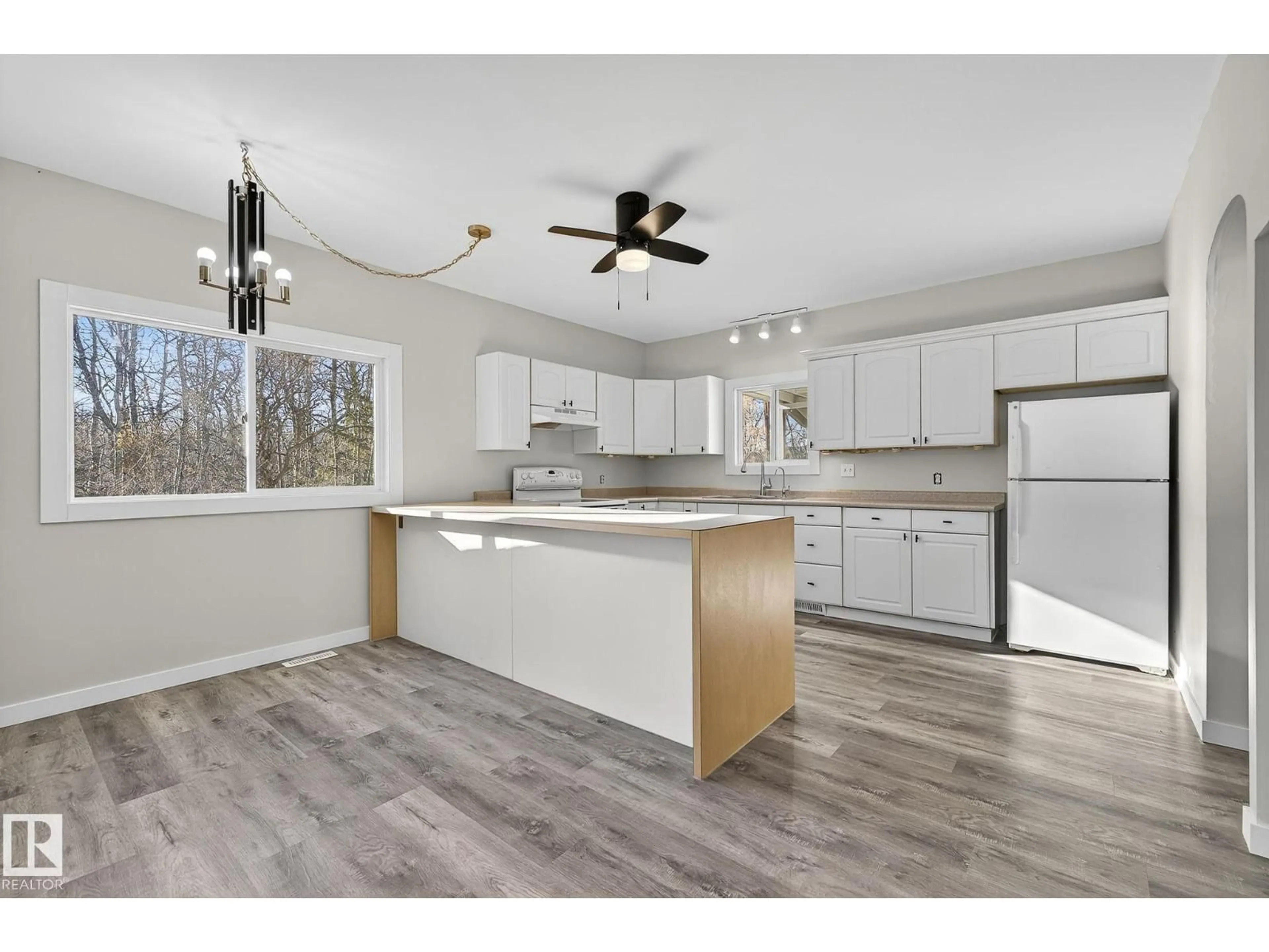 Open concept kitchen, wood/laminate floor for 49551 RANGE ROAD 202, Rural Camrose County Alberta T0B0C0
