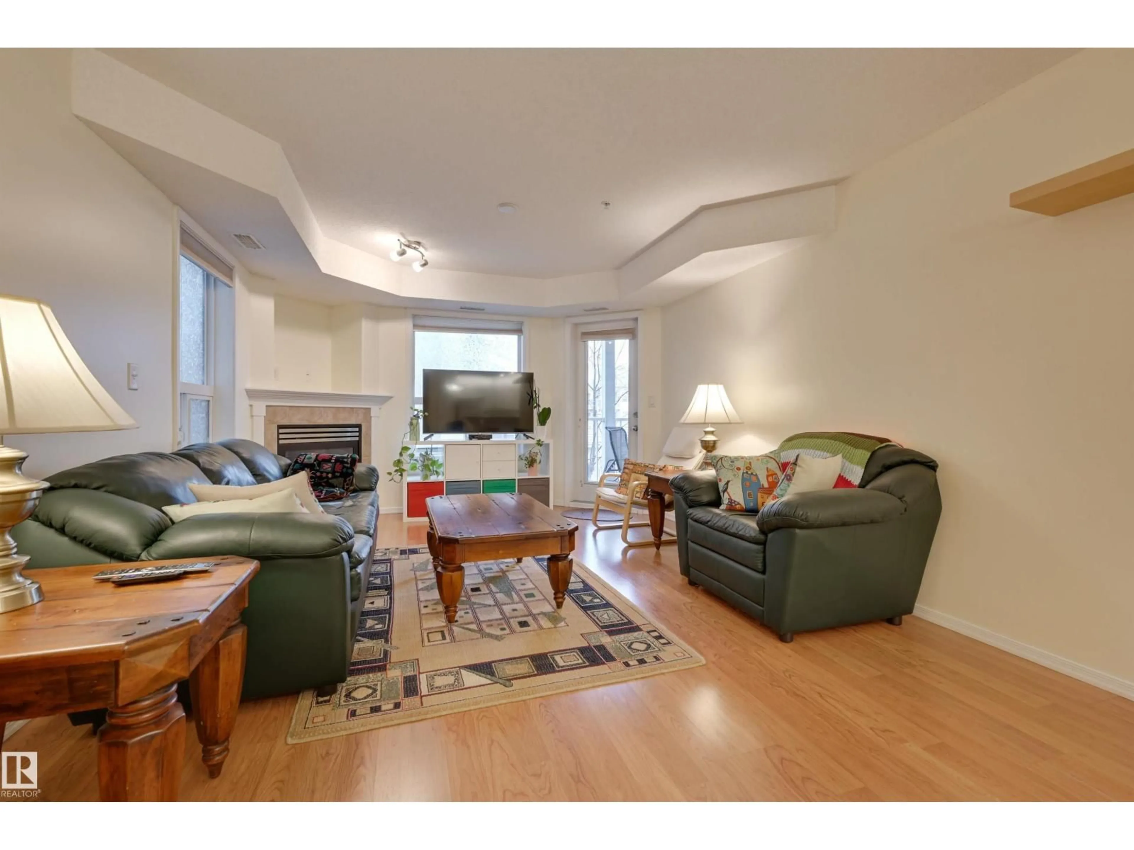 Living room with furniture, wood/laminate floor for #336 - 9008 99 AV, Edmonton Alberta T5H4M6