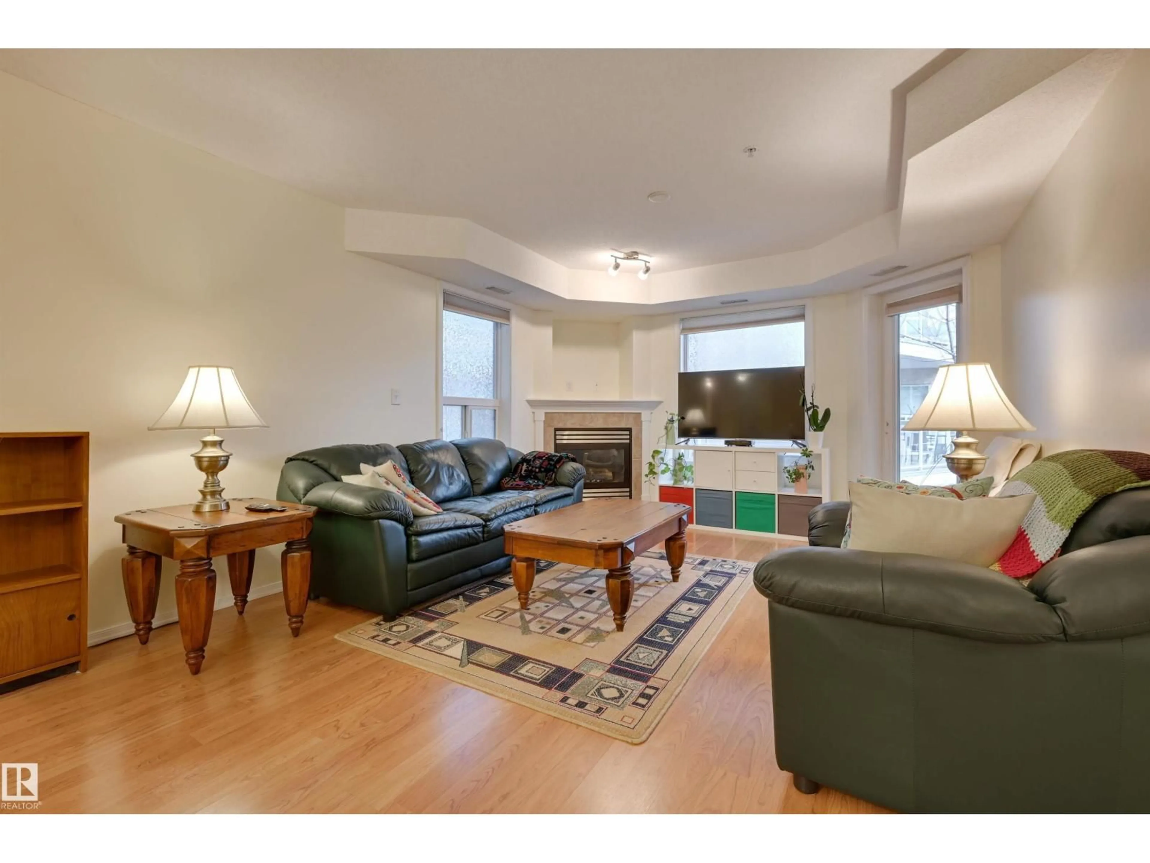 Living room with furniture, wood/laminate floor for #336 - 9008 99 AV, Edmonton Alberta T5H4M6