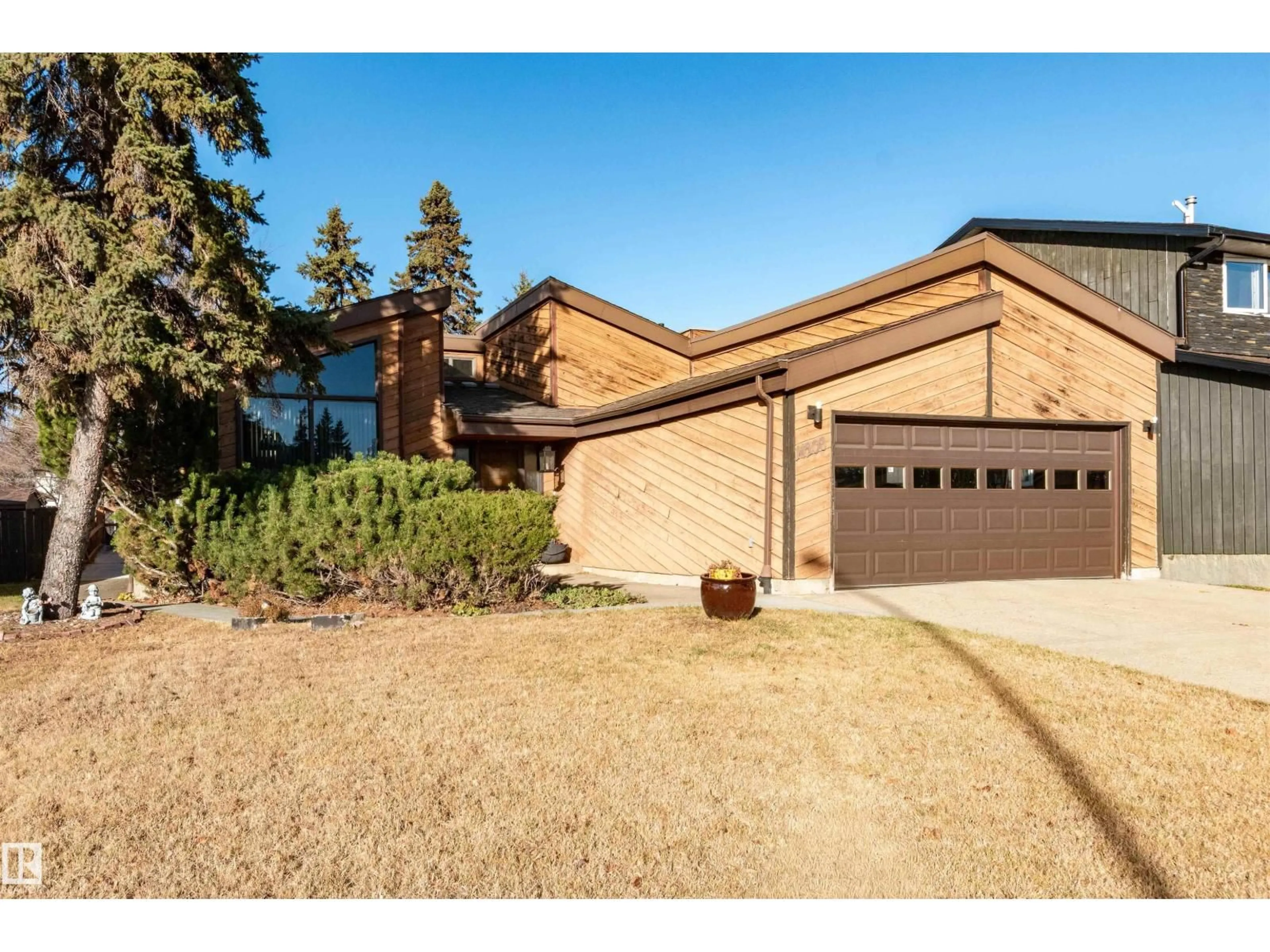 Home with brick exterior material, street for NW - 14208 21 ST, Edmonton Alberta T5Y1C8