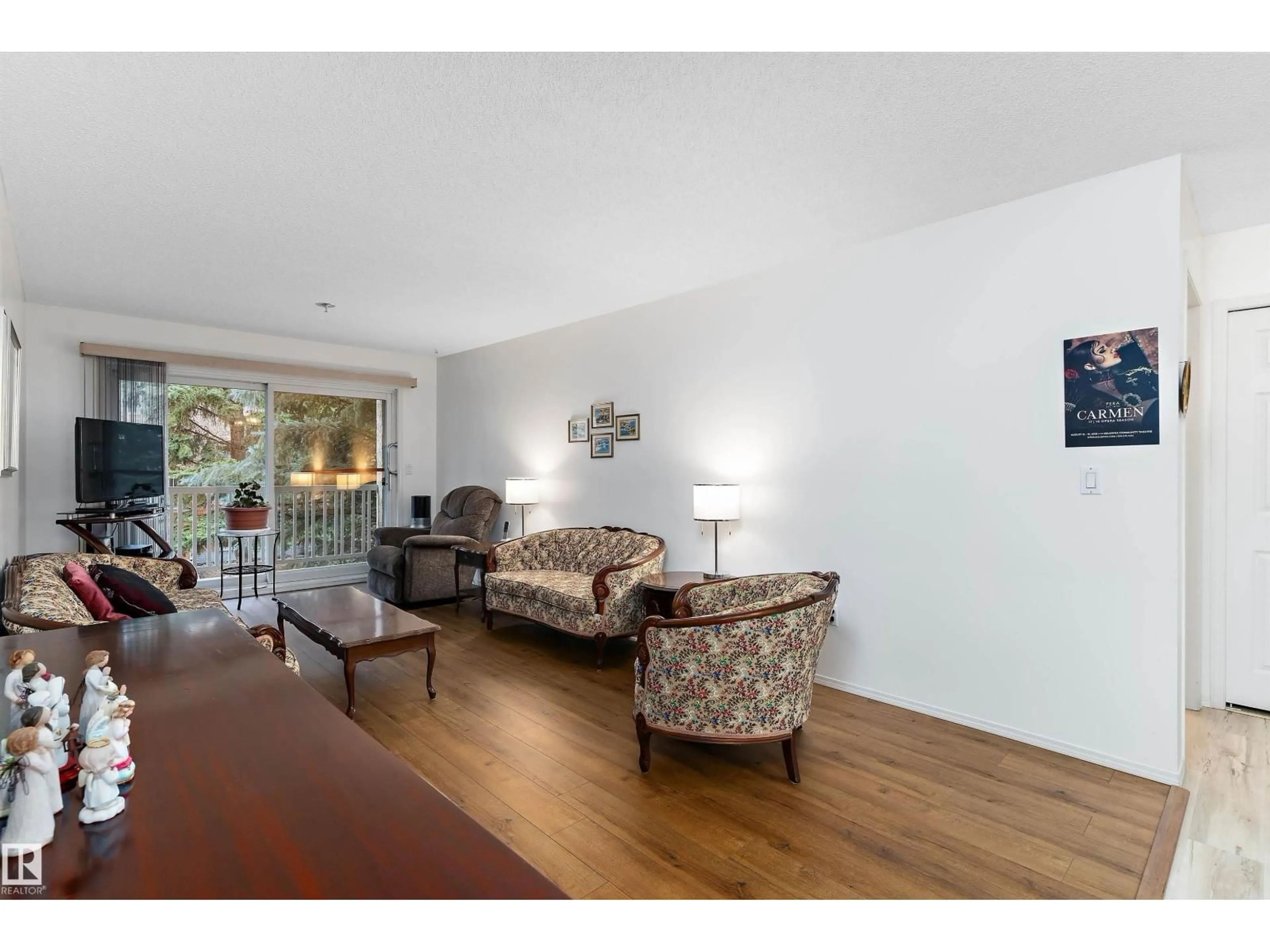 Living room with furniture, wood/laminate floor for #209 - 10915 21 AV, Edmonton Alberta T6J6X2