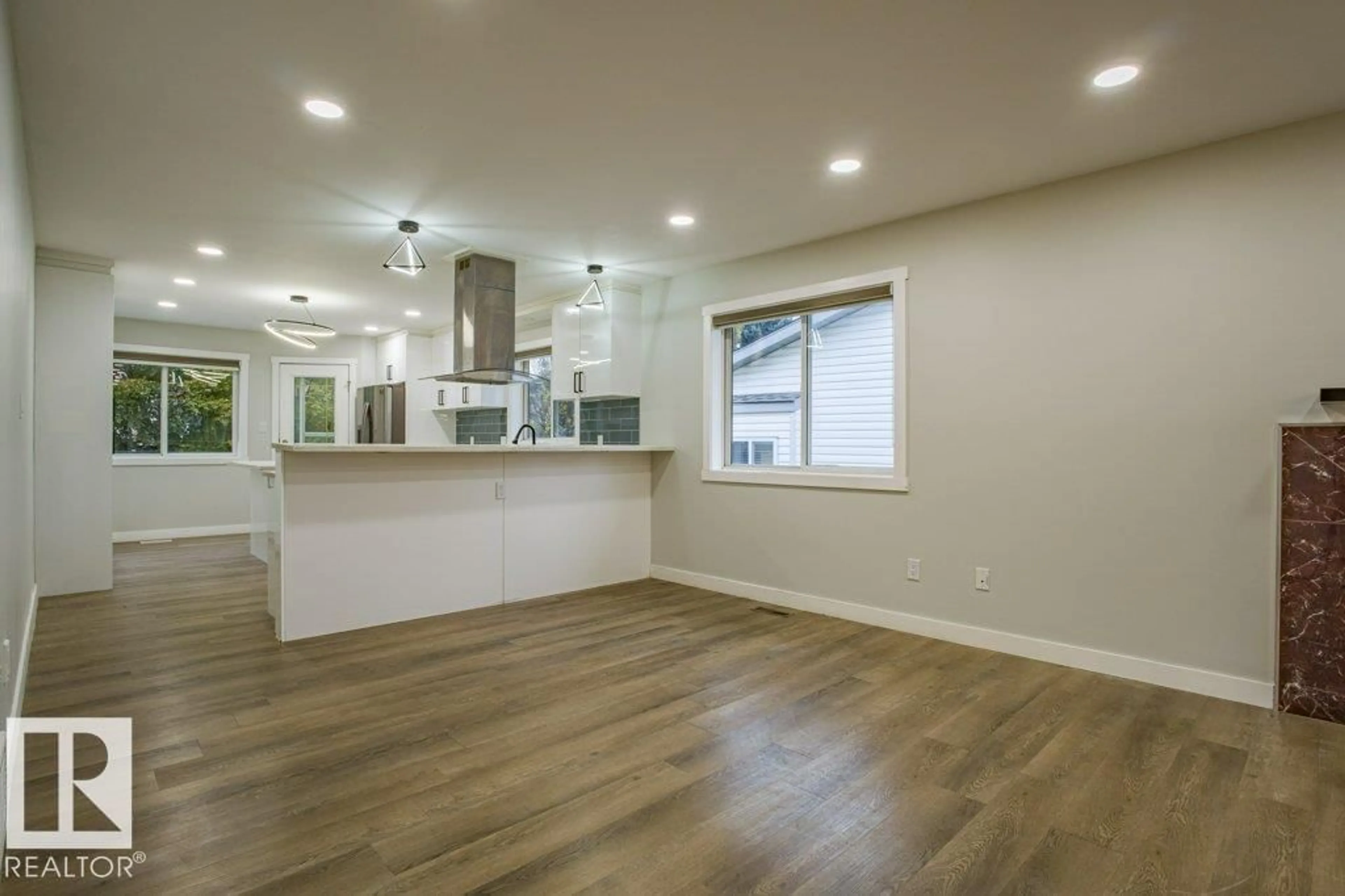 Open concept kitchen, wood/laminate floor for 52 JEFFERSON RD, Edmonton Alberta T6L6R9