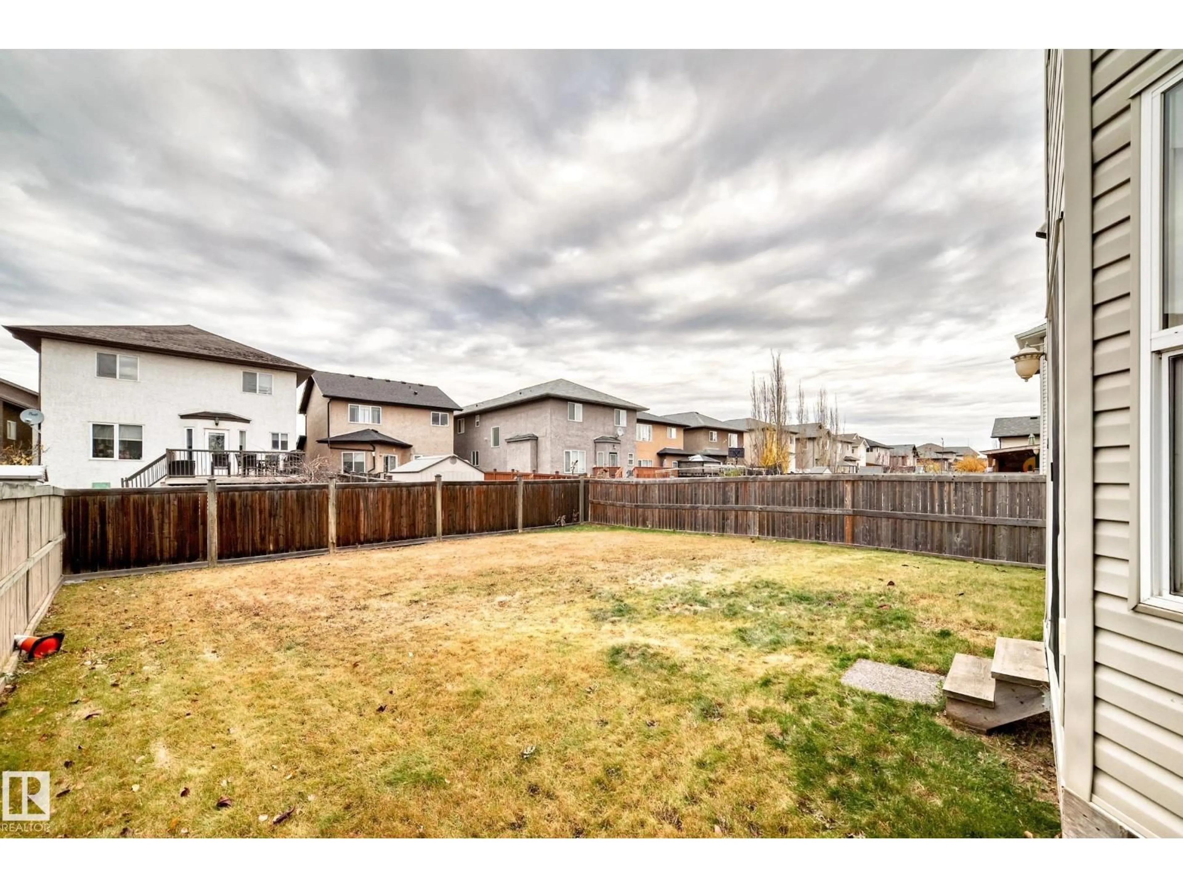 A pic from outside/outdoor area/front of a property/back of a property/a pic from drone, unknown for 5930 165 AV, Edmonton Alberta T5Y0J1