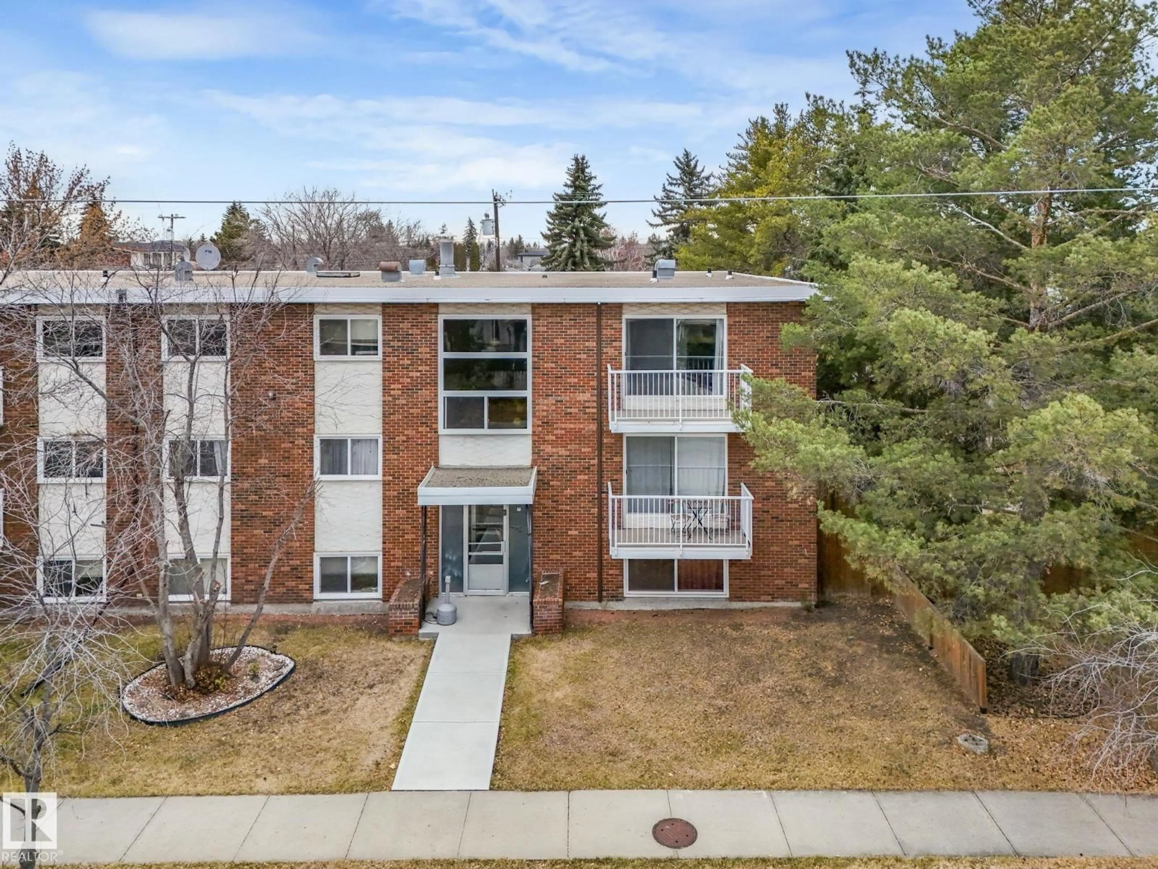 A pic from outside/outdoor area/front of a property/back of a property/a pic from drone, street for #305 - 13104 132 AV, Edmonton Alberta T5L3R3