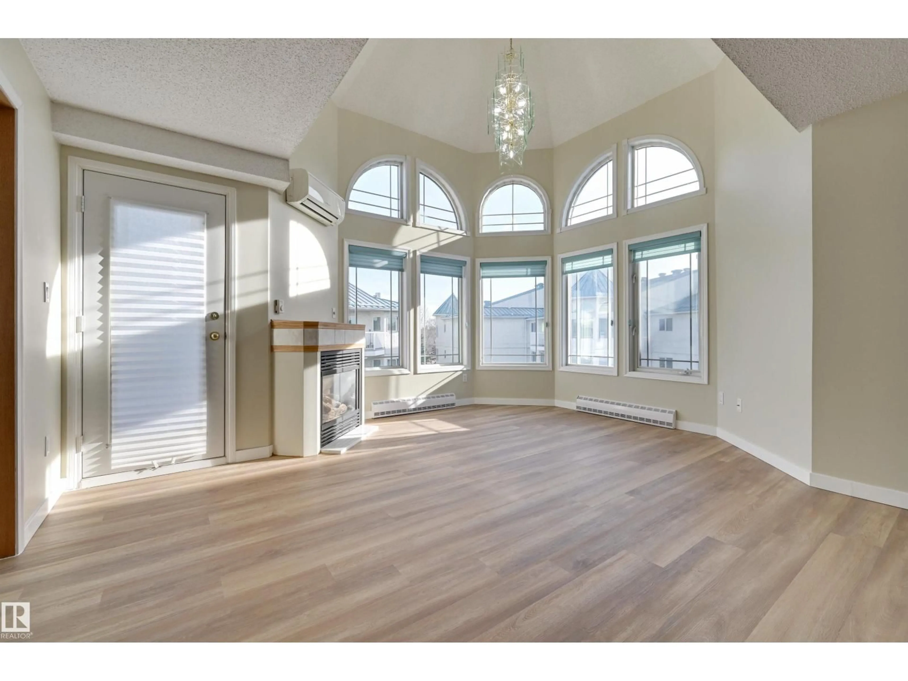 Open concept kitchen, wood/laminate floor for #405 - 5212 25 AV, Edmonton Alberta T6L6R7