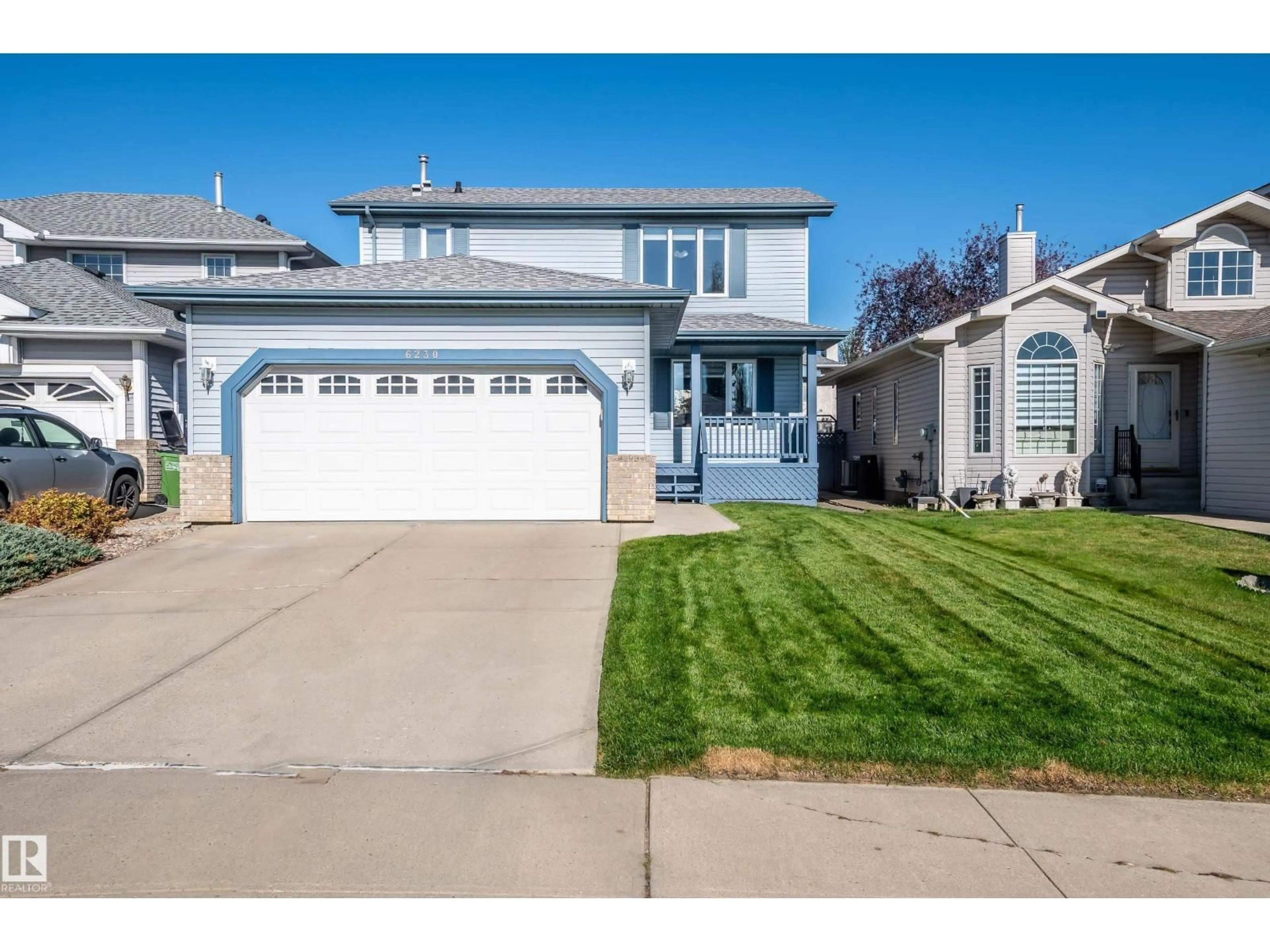 Home with vinyl exterior material, street for 6230 159A AV, Edmonton Alberta T5Y2R9