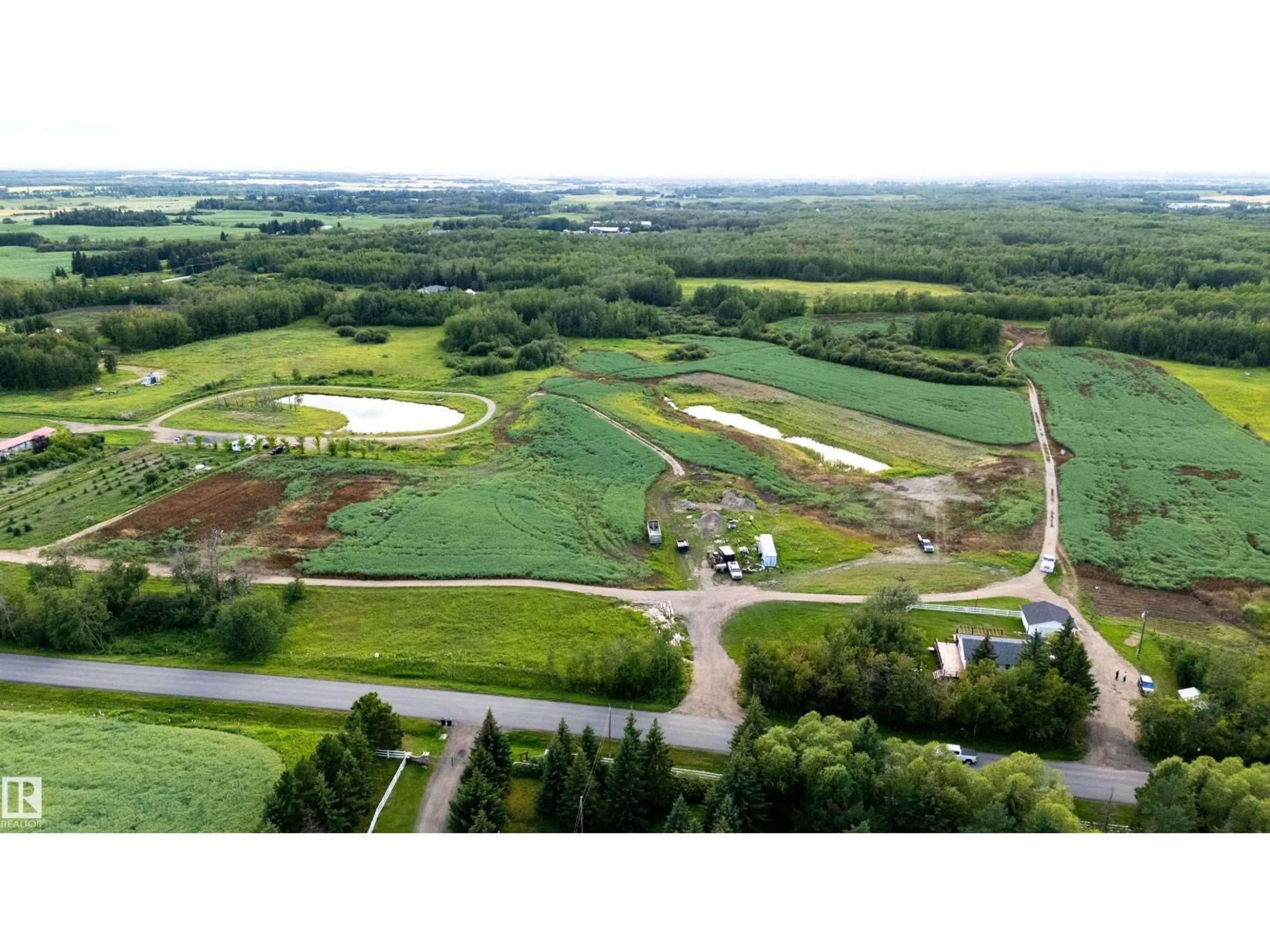 A pic from outside/outdoor area/front of a property/back of a property/a pic from drone, unknown for 52028 RGE ROAD 231, Rural Strathcona County Alberta T8B1A3