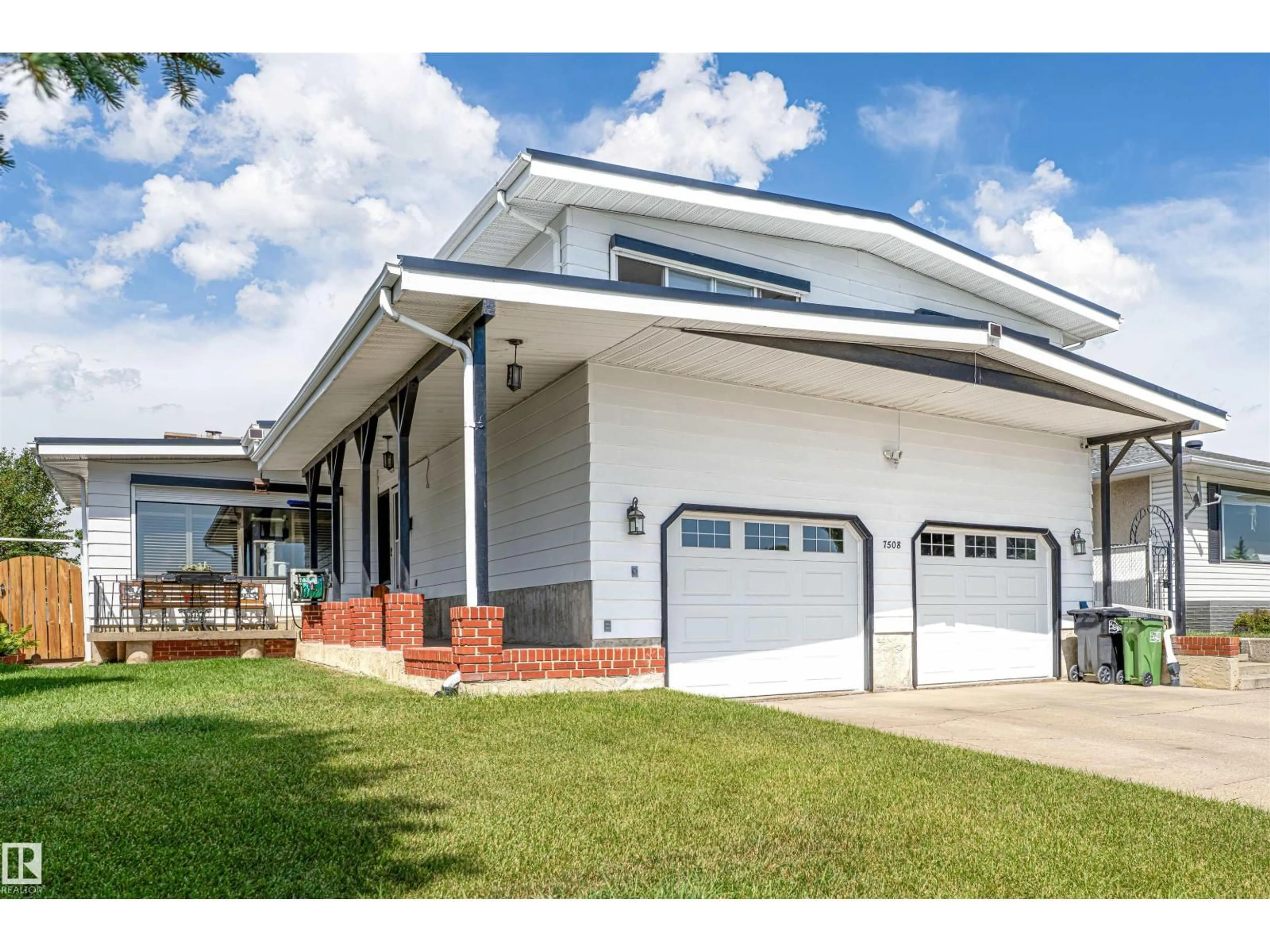 Home with vinyl exterior material, street for 7508 147 AV, Edmonton Alberta T5C2T2