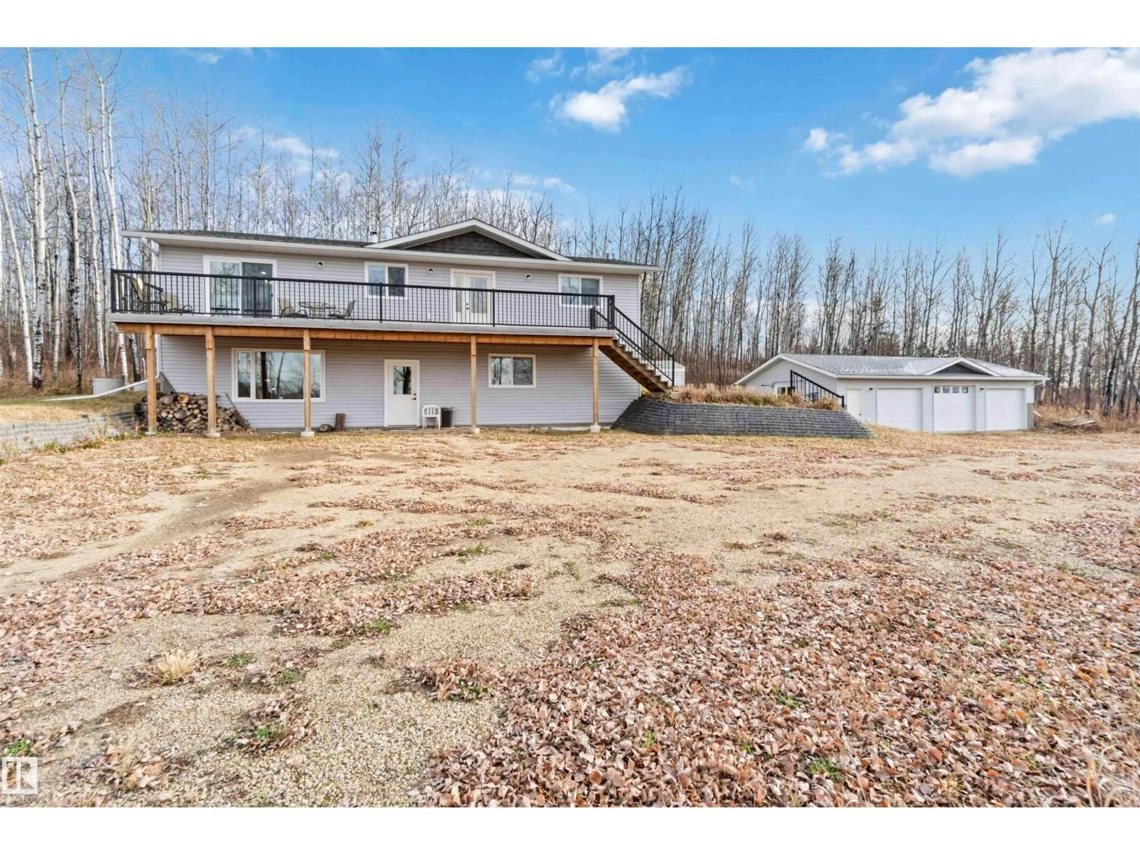 A pic from outside/outdoor area/front of a property/back of a property/a pic from drone, water/lake/river/ocean view for 59209 - 30 HWY 18, Rural Barrhead County Alberta T7N1N3
