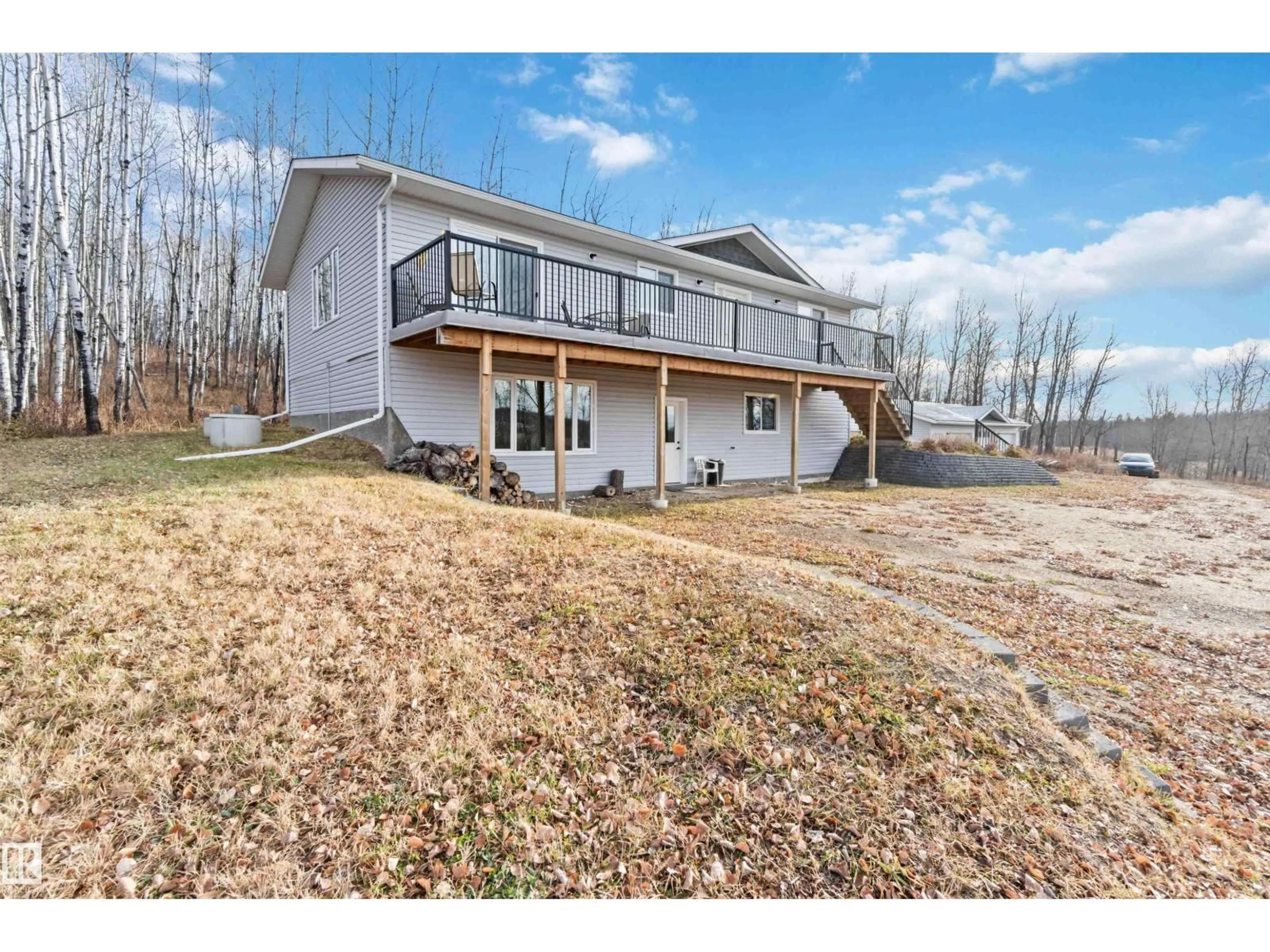 A pic from outside/outdoor area/front of a property/back of a property/a pic from drone, unknown for 59209 - 30 HWY 18, Rural Barrhead County Alberta T7N1N3