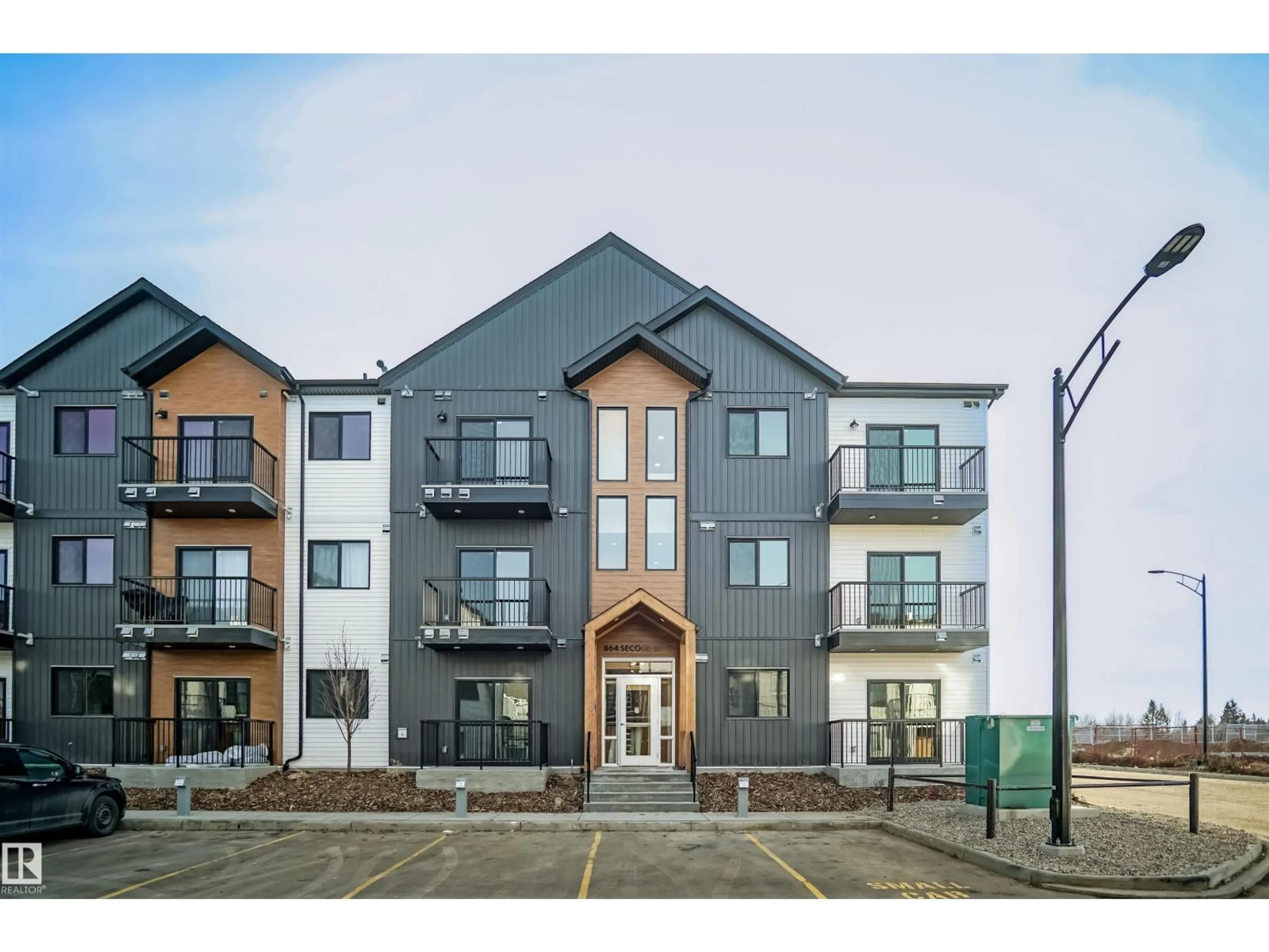 A pic from outside/outdoor area/front of a property/back of a property/a pic from drone, building for #302 - 9227 228 ST NW, Edmonton Alberta T5T7R9