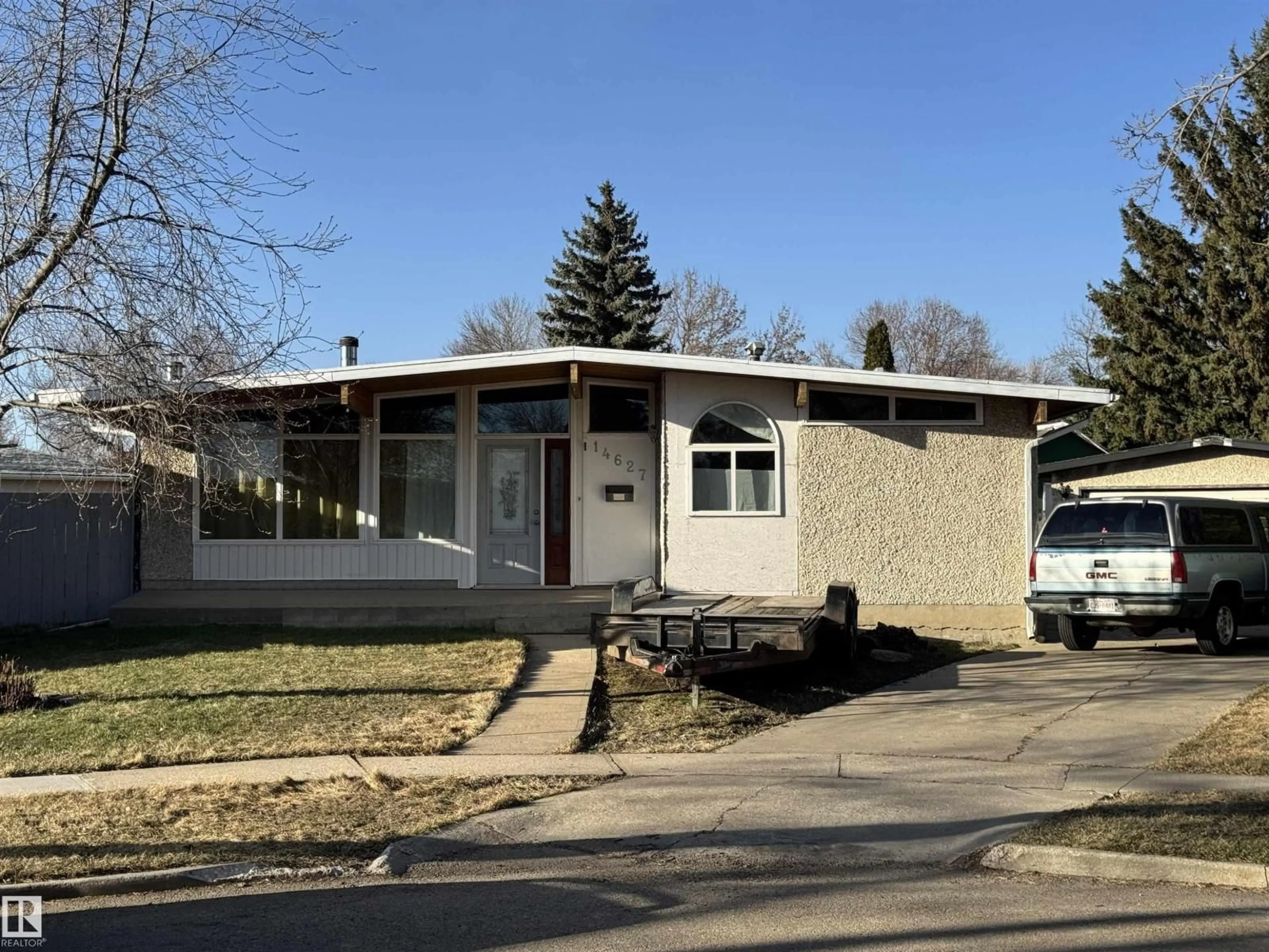 Home with vinyl exterior material, street for NW - 14627 60 ST, Edmonton Alberta T5A1Z3