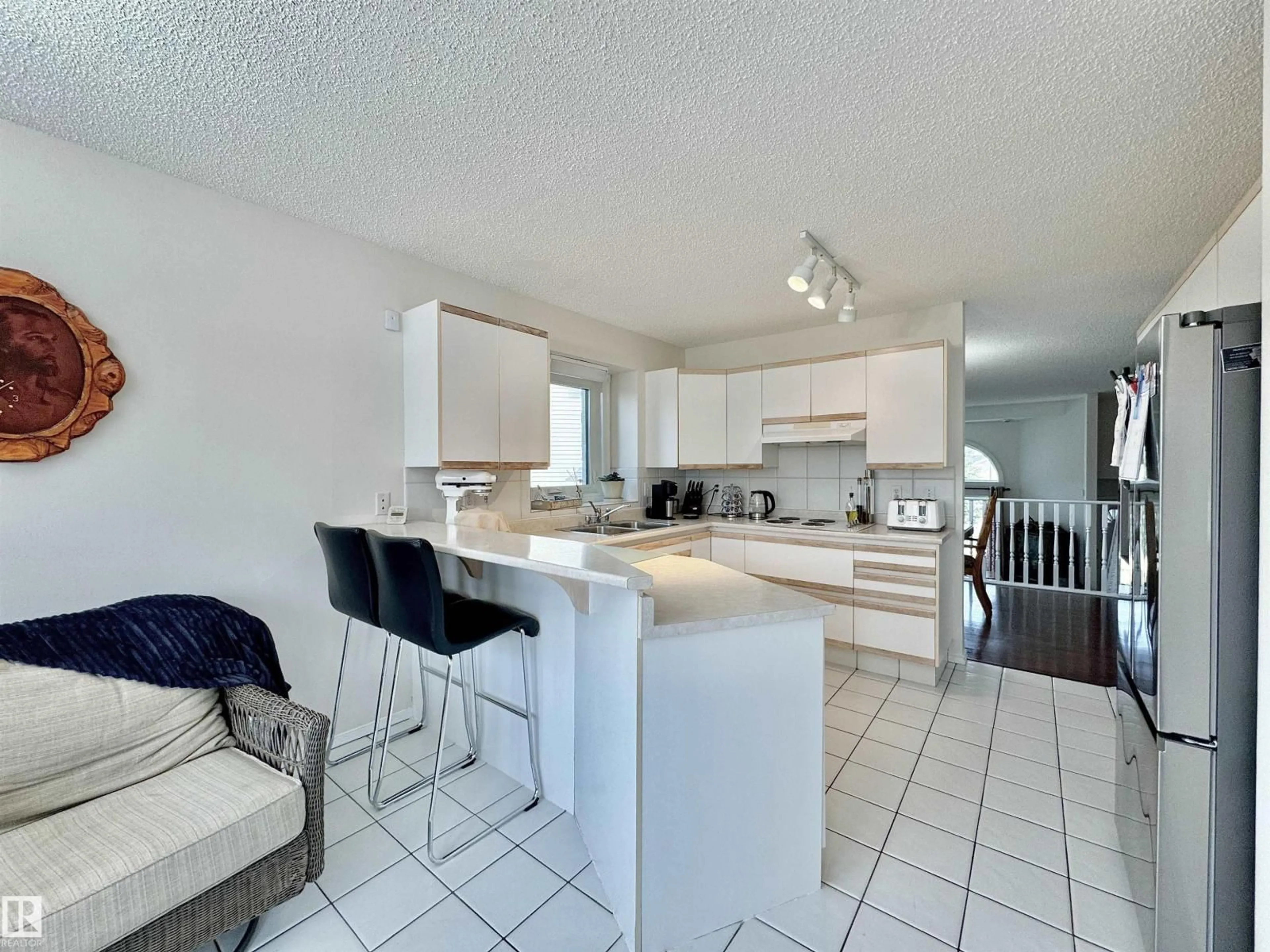 Open concept kitchen, ceramic/tile floor for 3772 30 ST, Edmonton Alberta T6T1H6