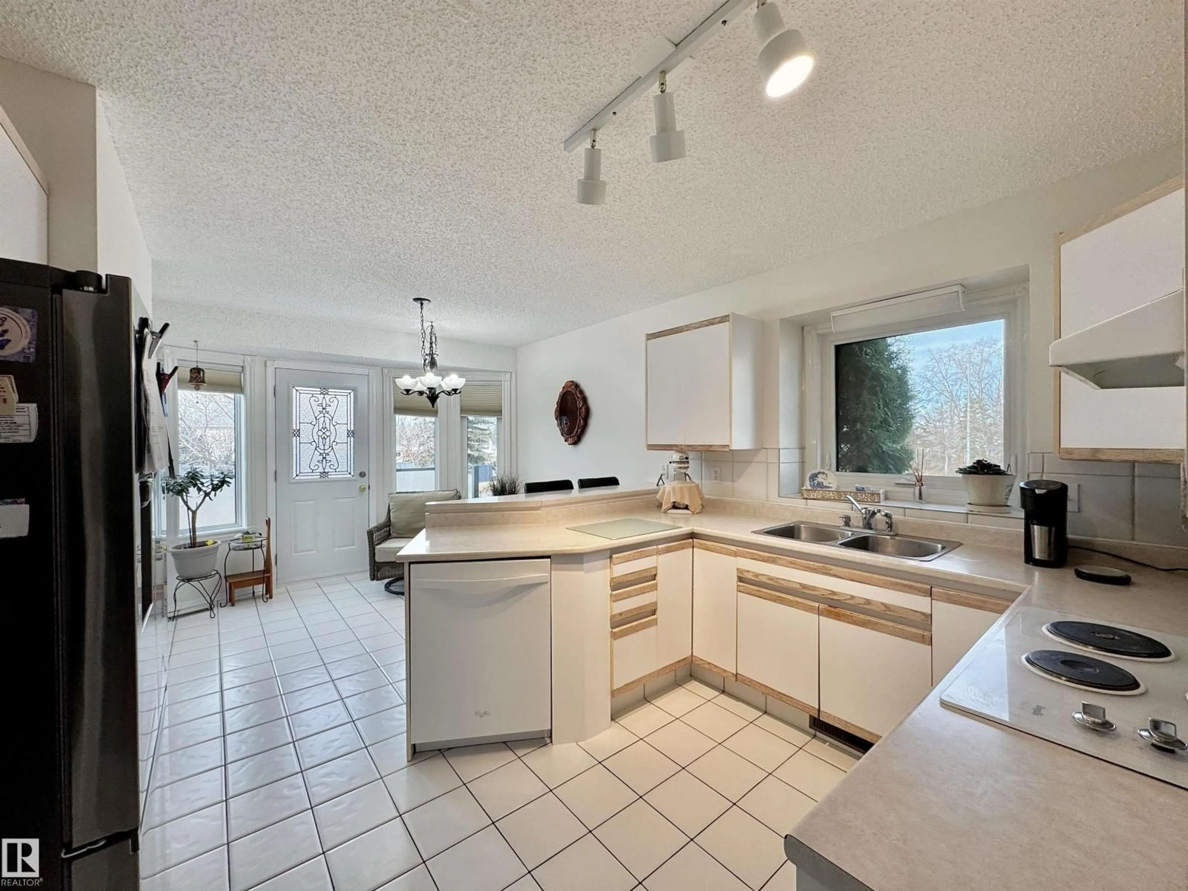Open concept kitchen, ceramic/tile floor for 3772 30 ST, Edmonton Alberta T6T1H6