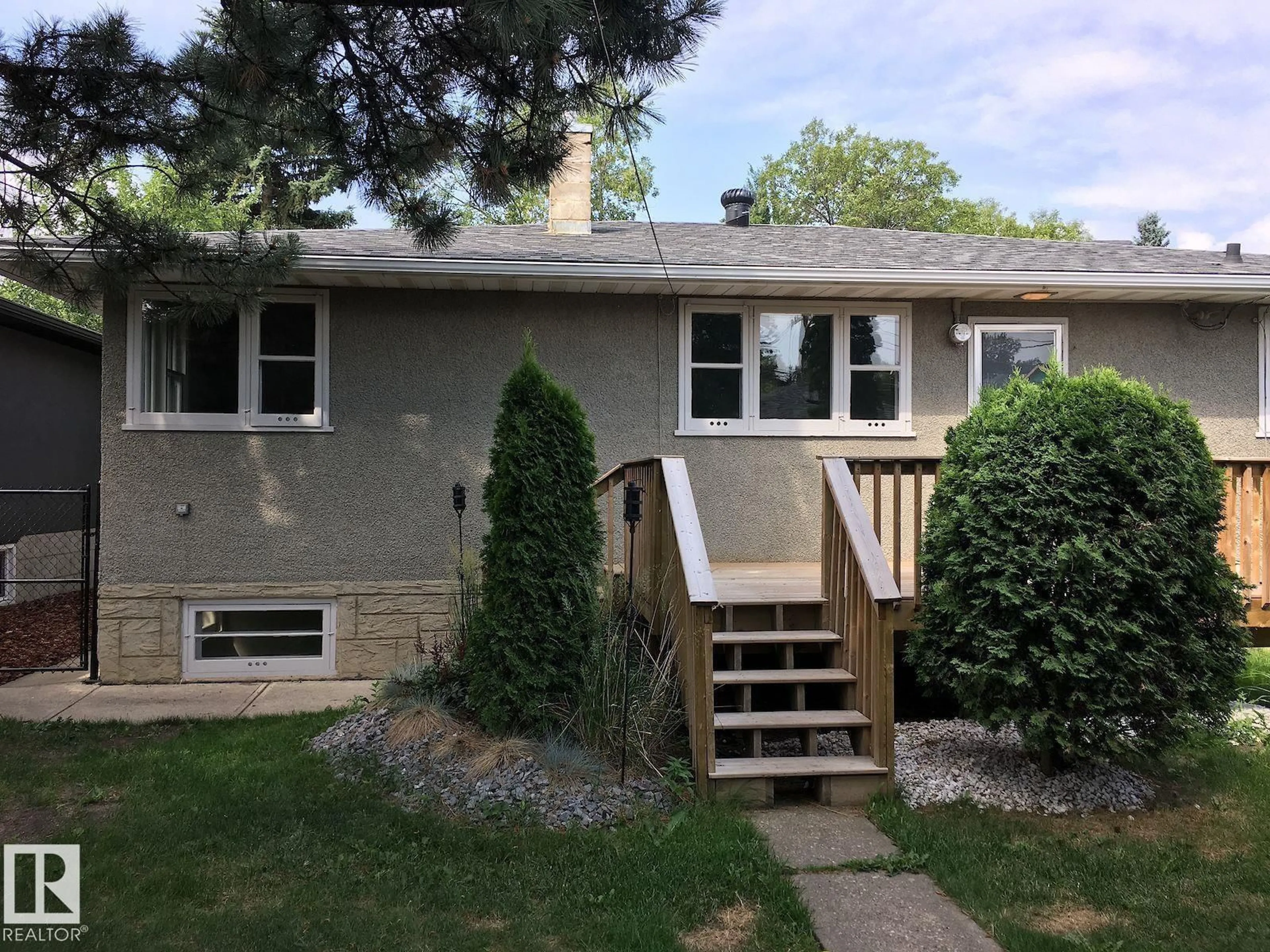 Home with vinyl exterior material, street for NW - 10707 129 ST, Edmonton Alberta T5N1Y2