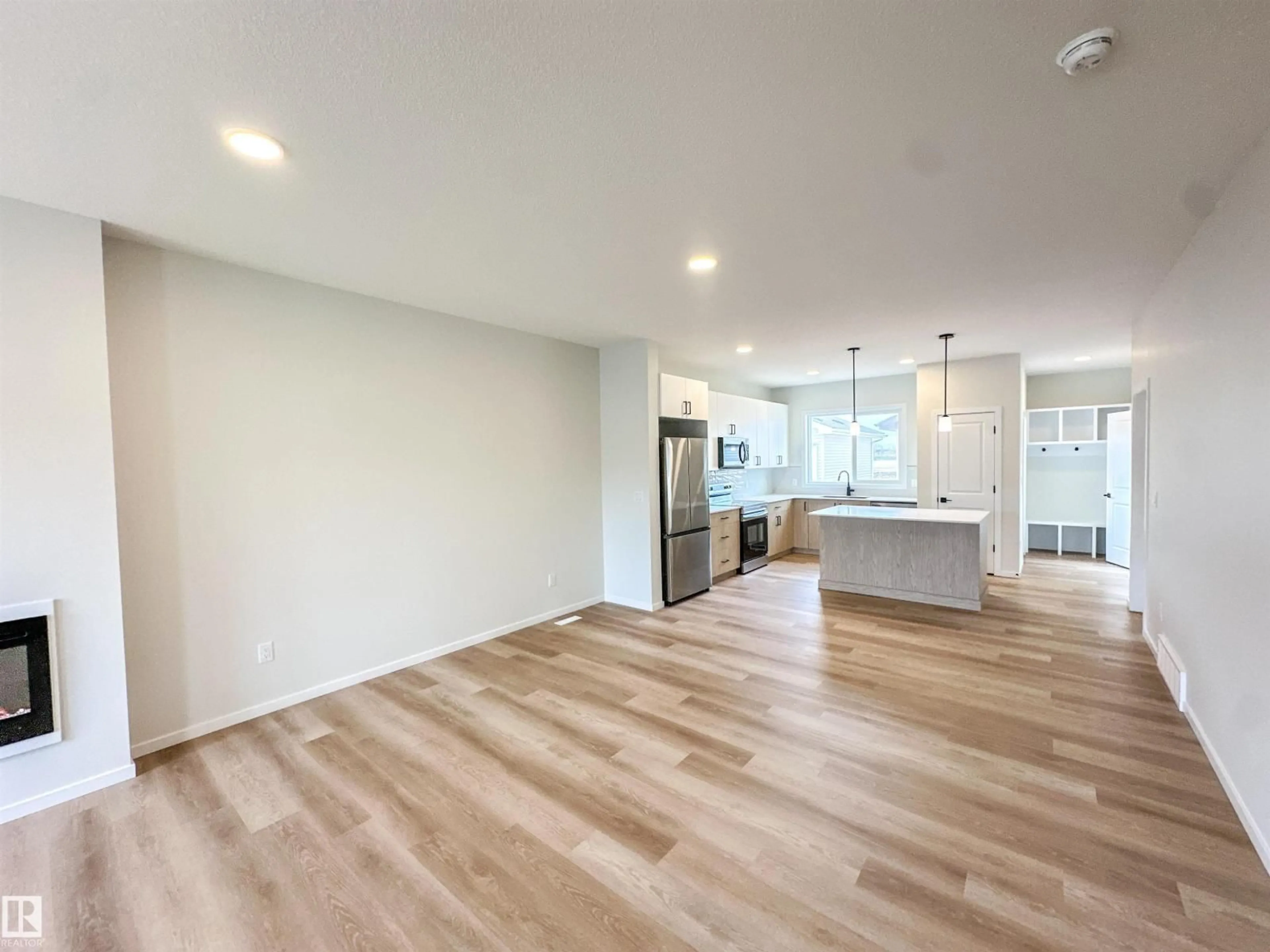 Open concept kitchen, wood/laminate floor for 107 BRICKYARD DR, Stony Plain Alberta T7Z0P2