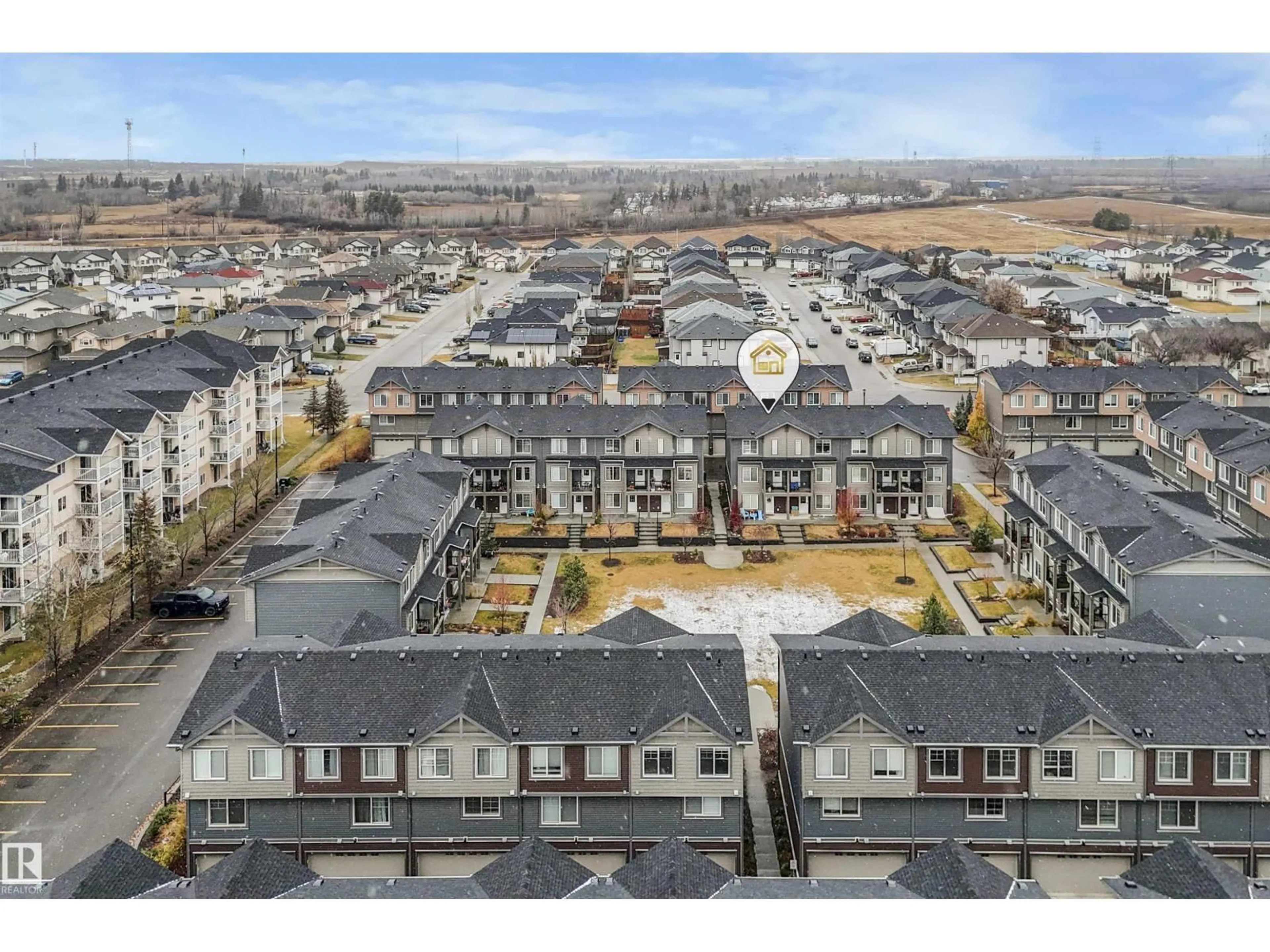 A pic from outside/outdoor area/front of a property/back of a property/a pic from drone, mountain view for #40 - 3025 151 AV, Edmonton Alberta T5Y3W4