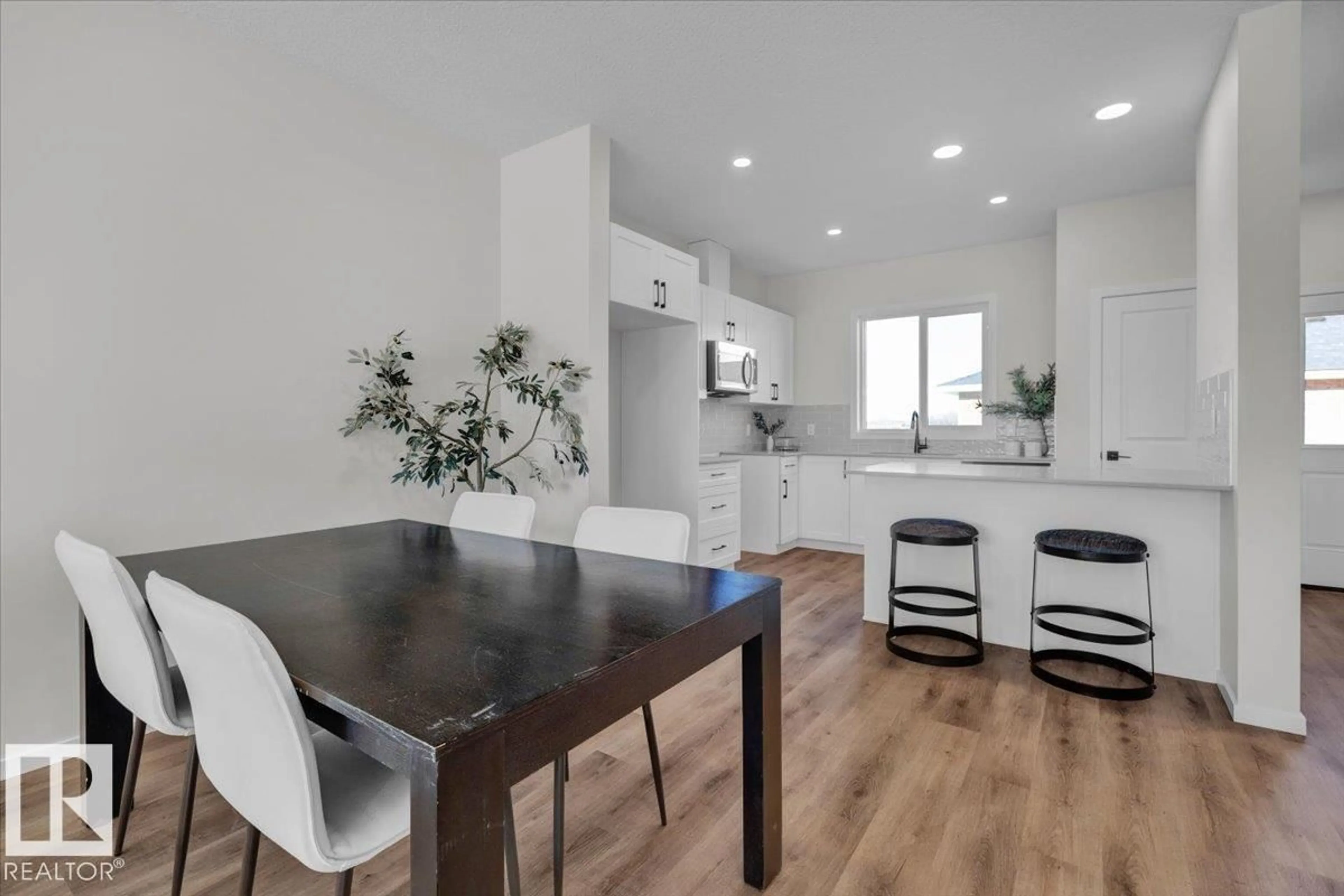 Open concept kitchen, wood/laminate floor for 85 BRICKYARD DR, Stony Plain Alberta T7Z0P2