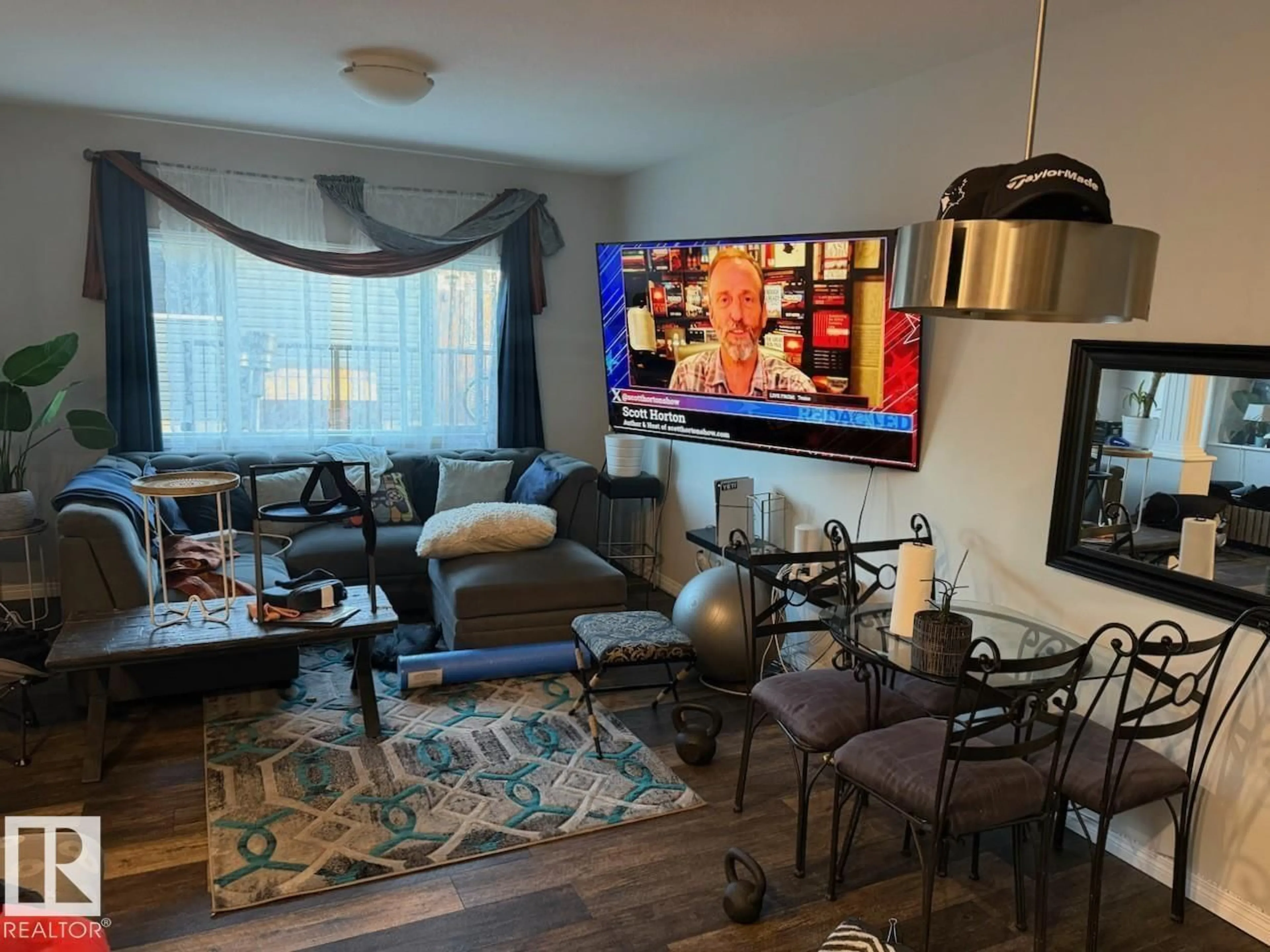 Living room with furniture, wood/laminate floor for 17907 62 ST, Edmonton Alberta T5Y3Z4