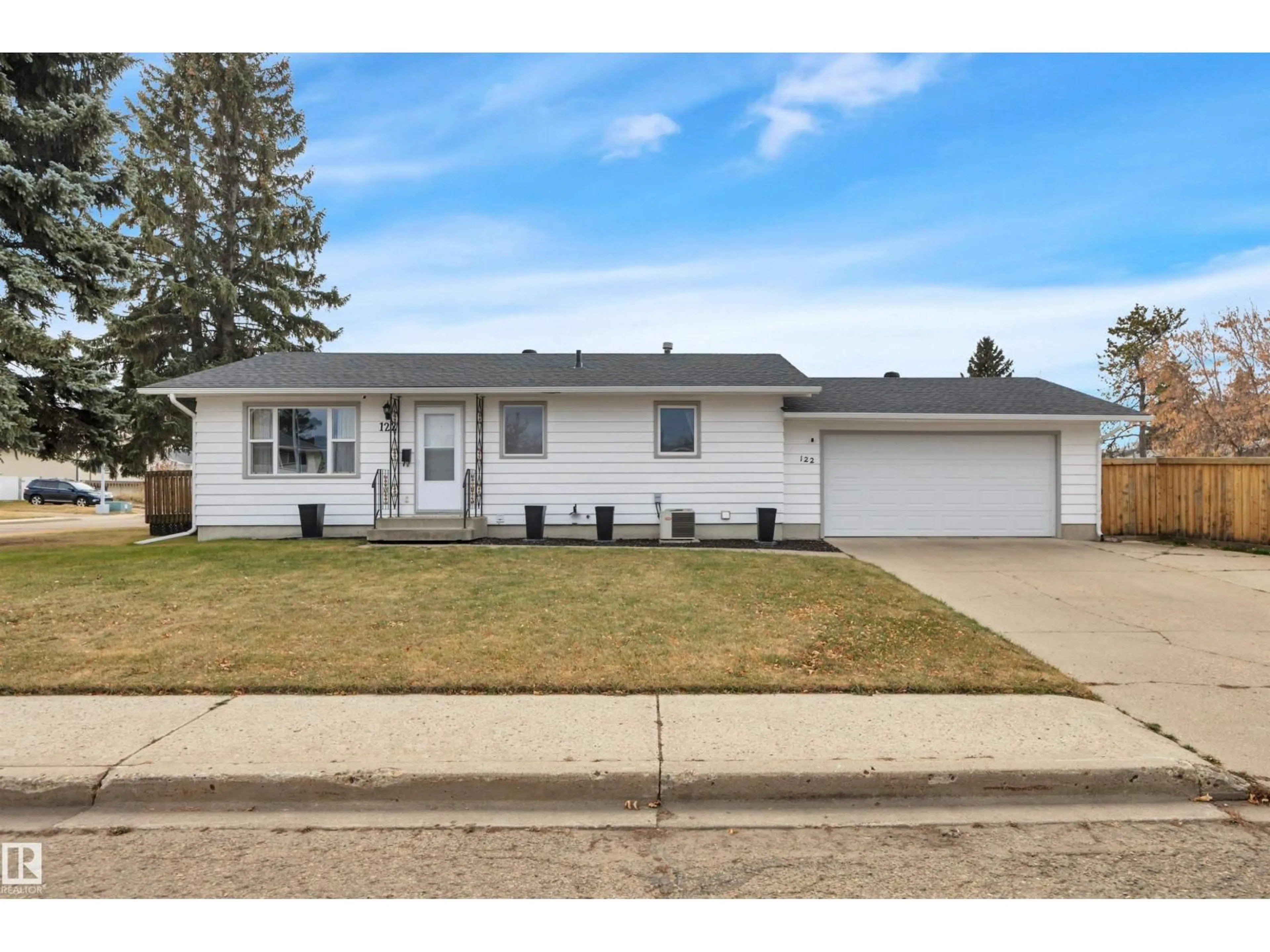 Home with vinyl exterior material, street for 122 MAPLE CR, Wetaskiwin Alberta T9A2E4