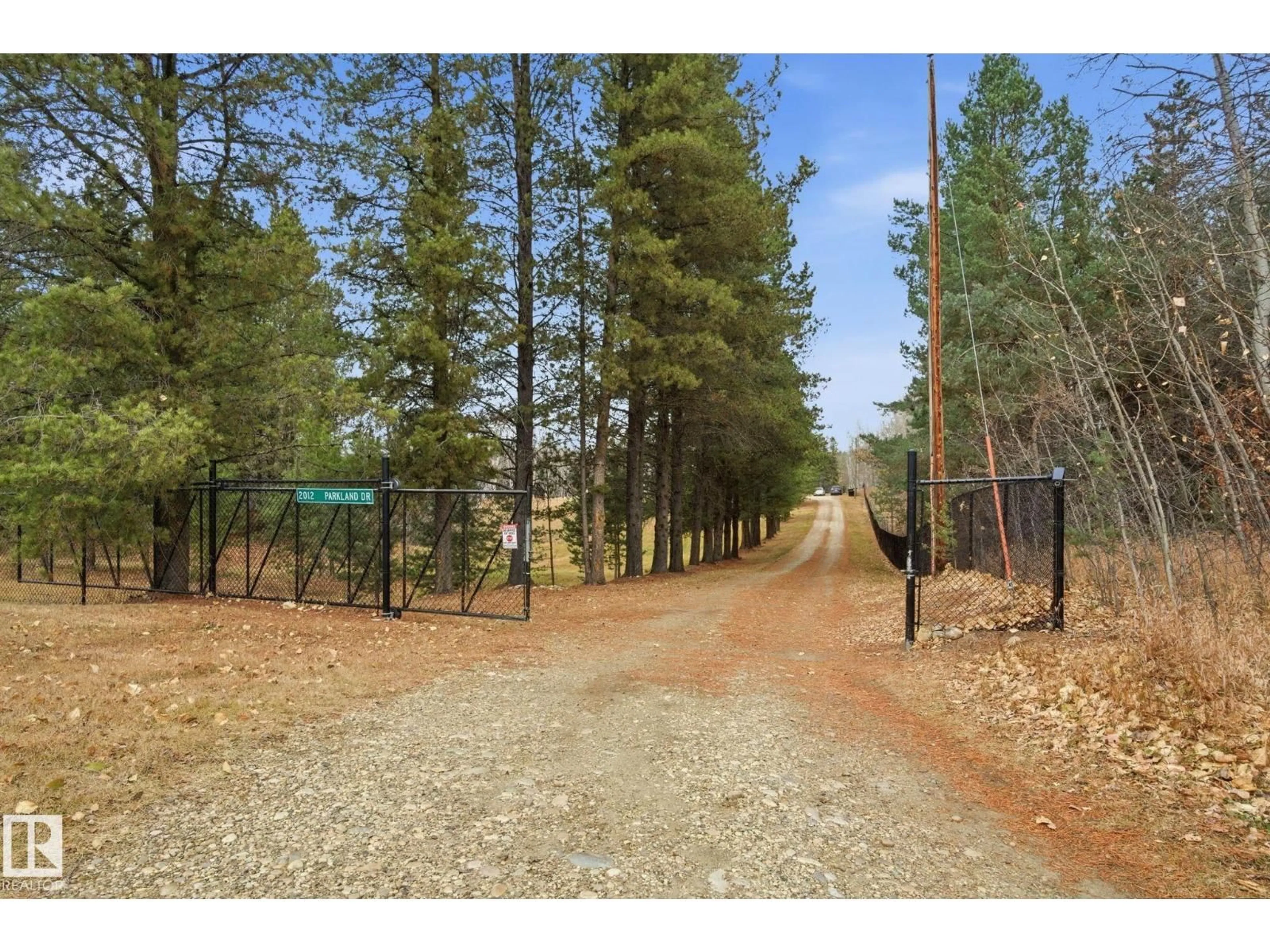 A pic from outside/outdoor area/front of a property/back of a property/a pic from drone, forest/trees view for 2012 PARKLAND DR, Rural Parkland County Alberta T7Y2S1