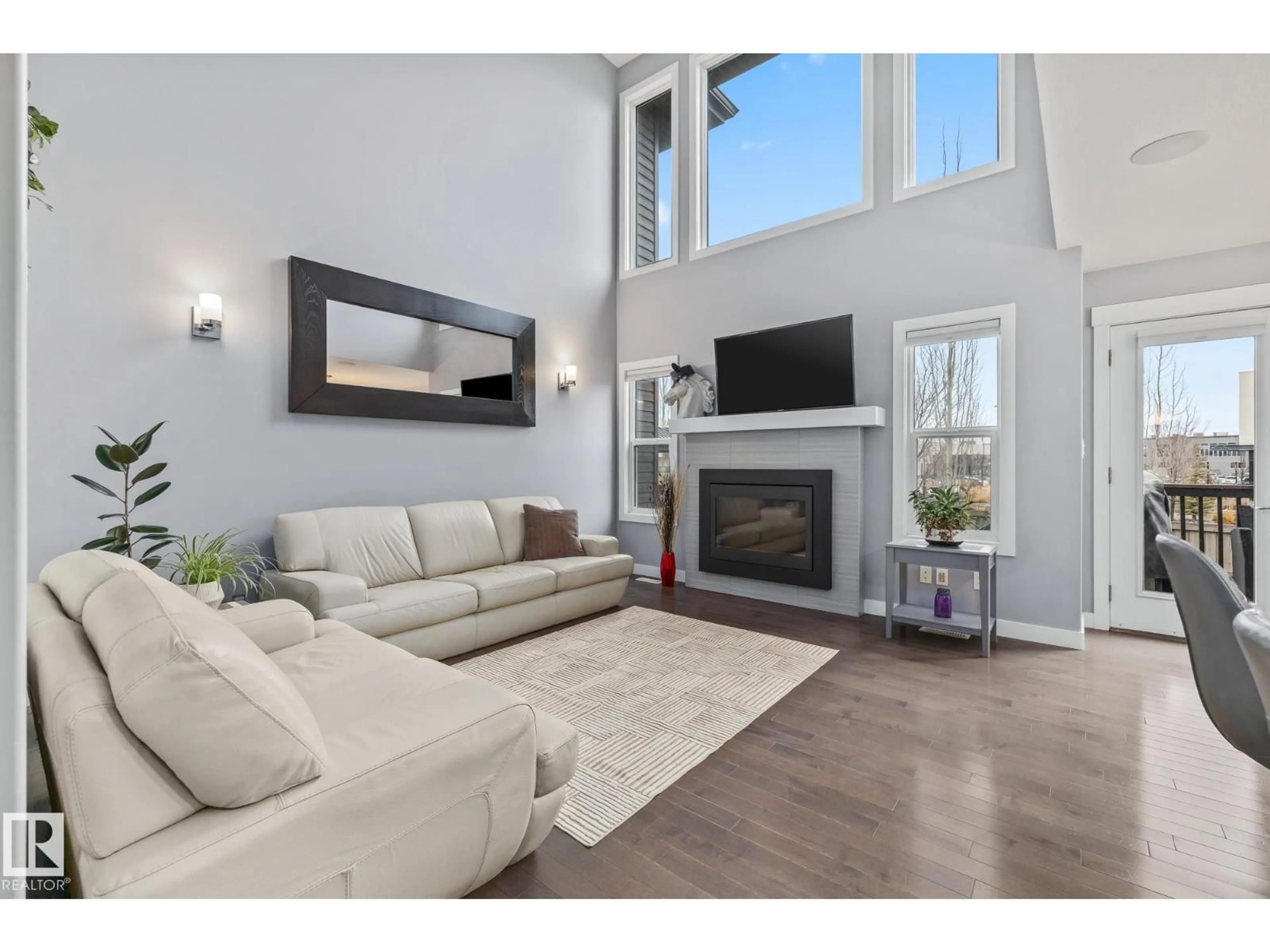 Living room with furniture, wood/laminate floor for 17504 13 AV, Edmonton Alberta T6W2J8