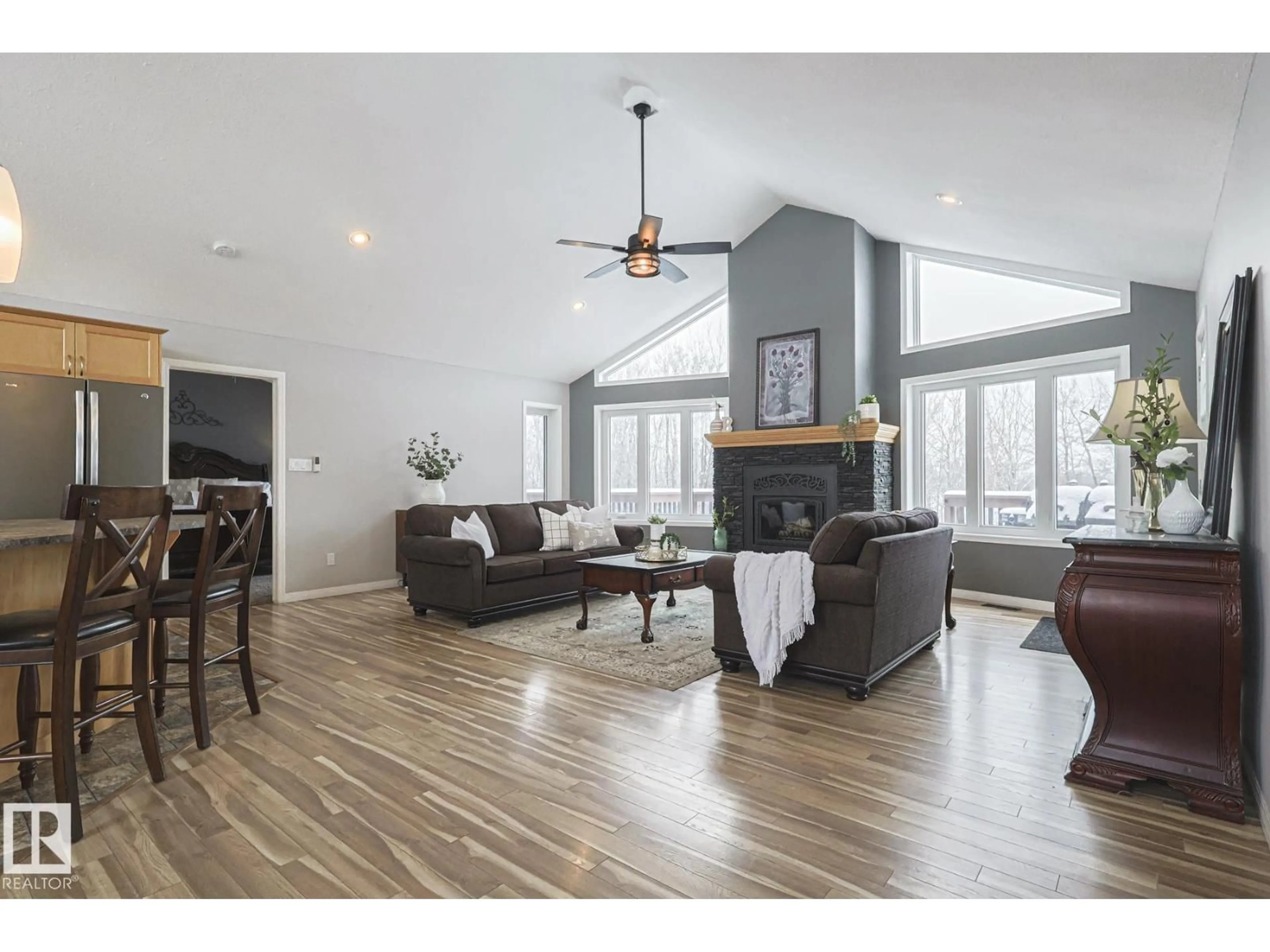 Living room with furniture, wood/laminate floor for 105 BUFFALO WY, Rural Thorhild County Alberta T0A2R0