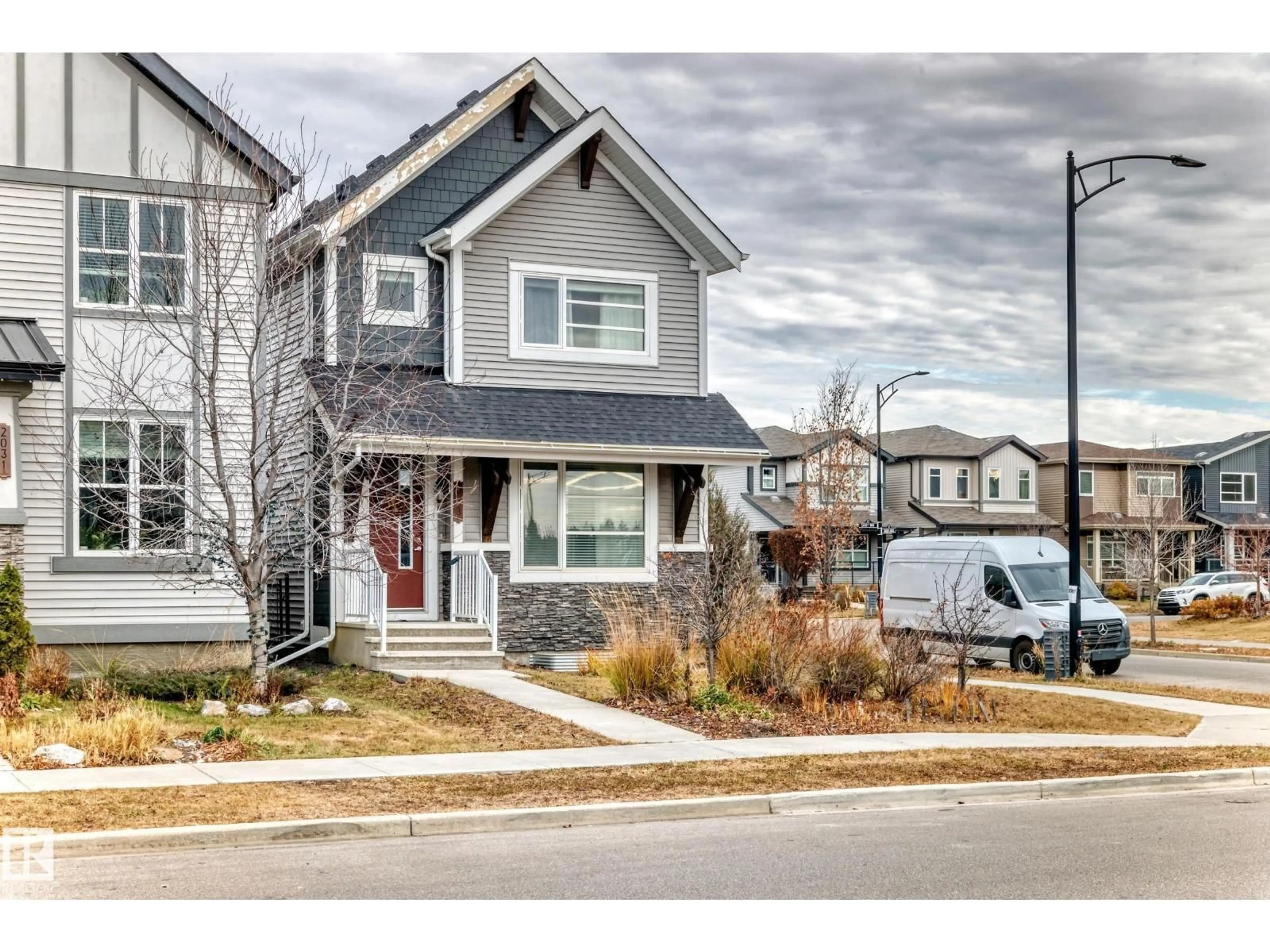 Home with vinyl exterior material, street for 2033 CAVANAGH DR, Edmonton Alberta T6W3M7