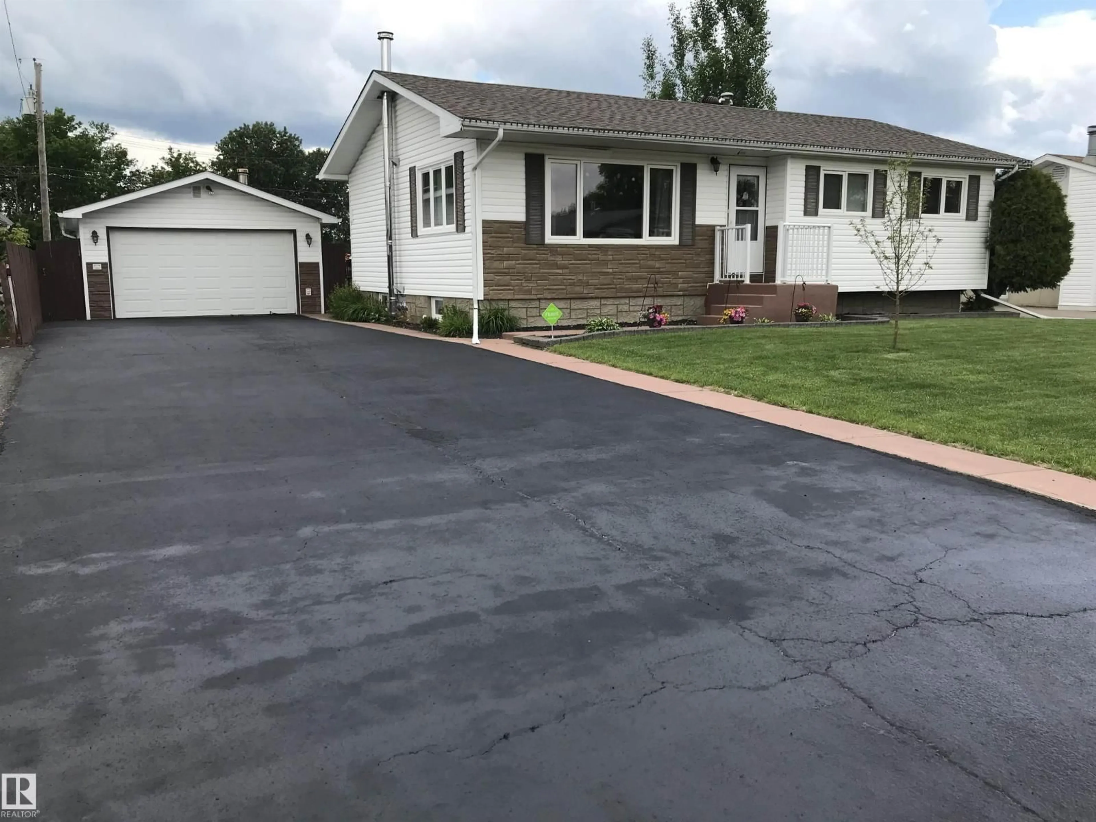 Home with vinyl exterior material, street for 4912 59 ST, Cold Lake Alberta T9M1T2